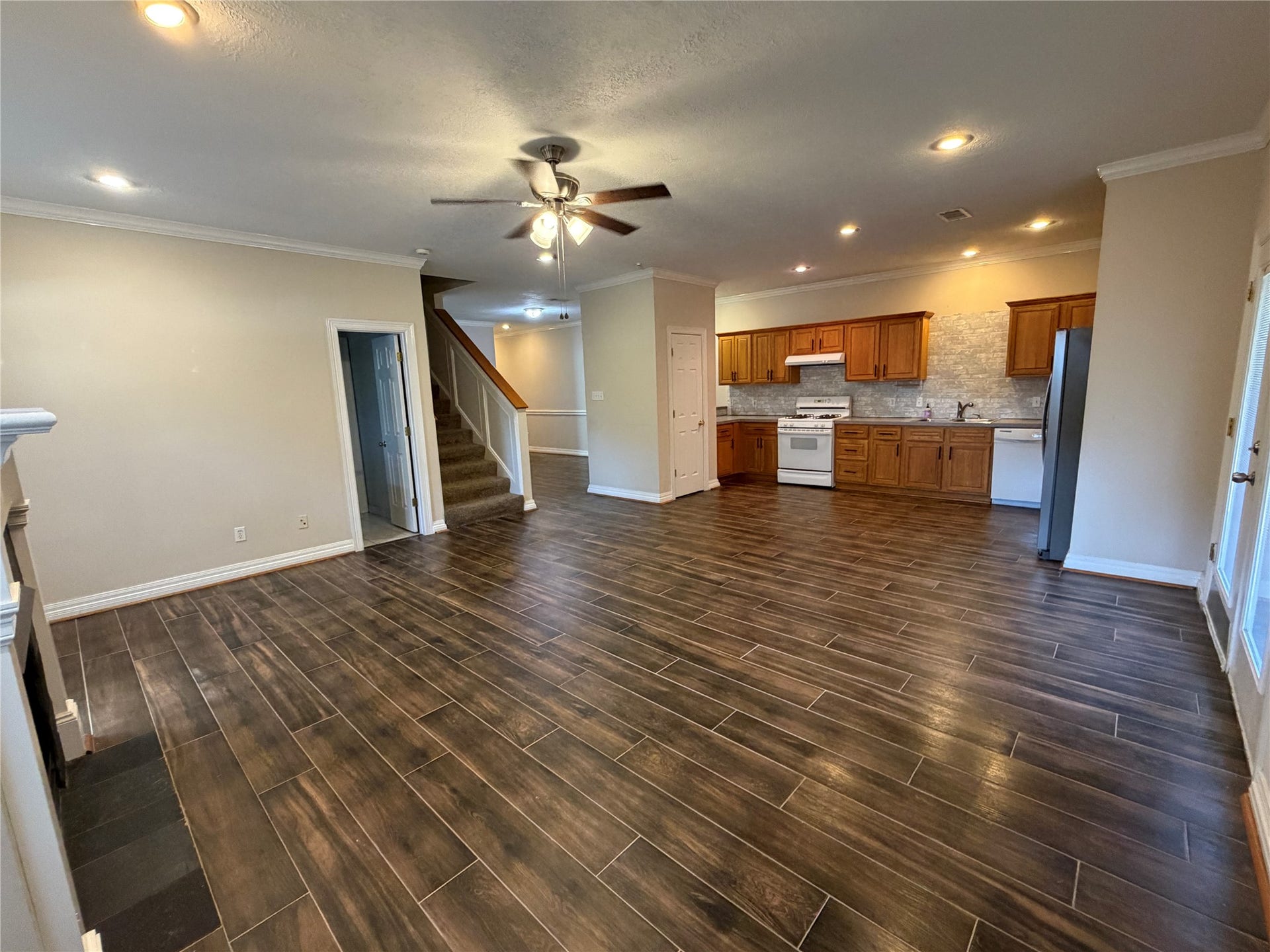 The home has an open floor plan from the kitchen to living room.