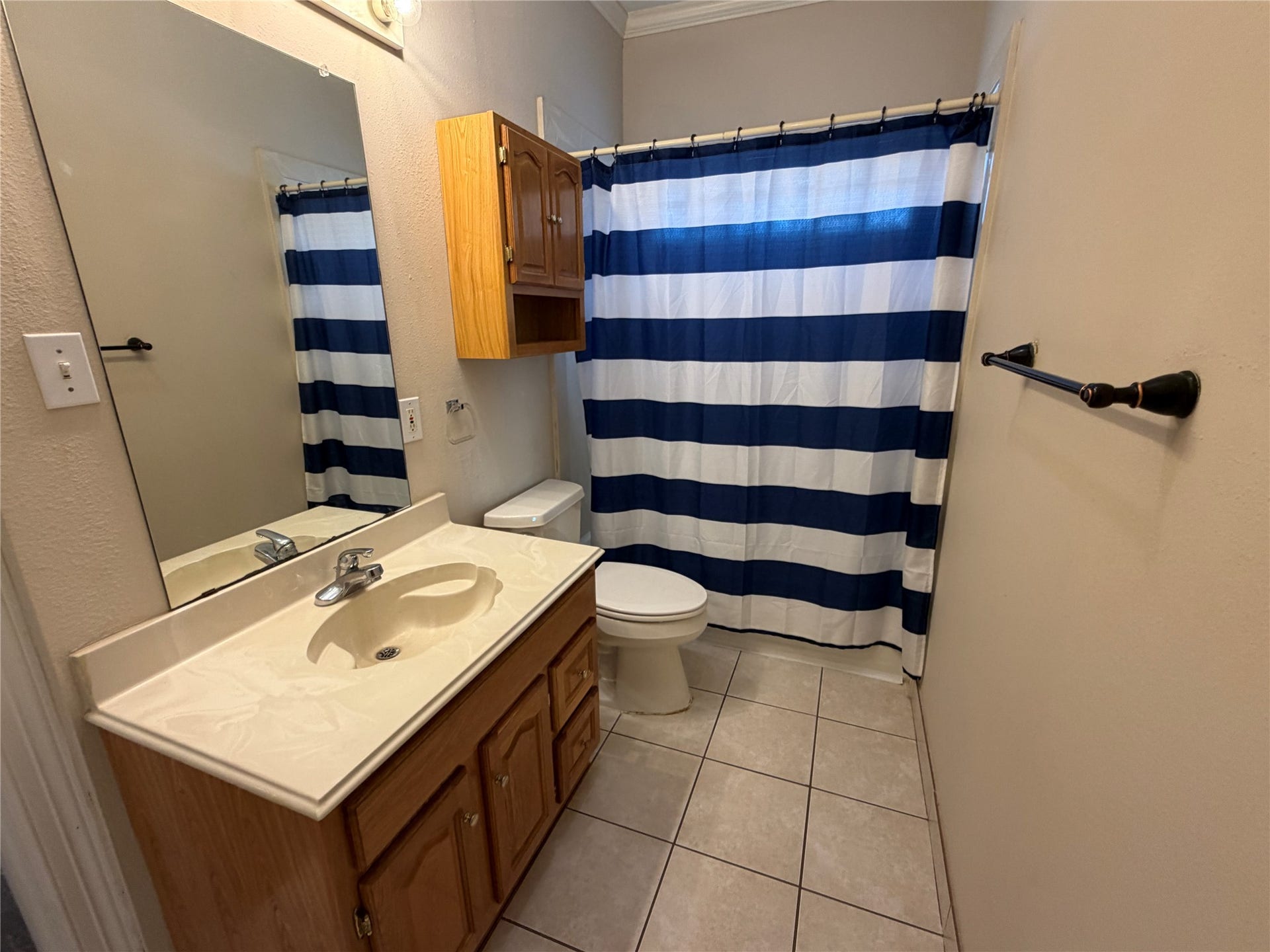 The primary bathroom features a shower/tub combination.