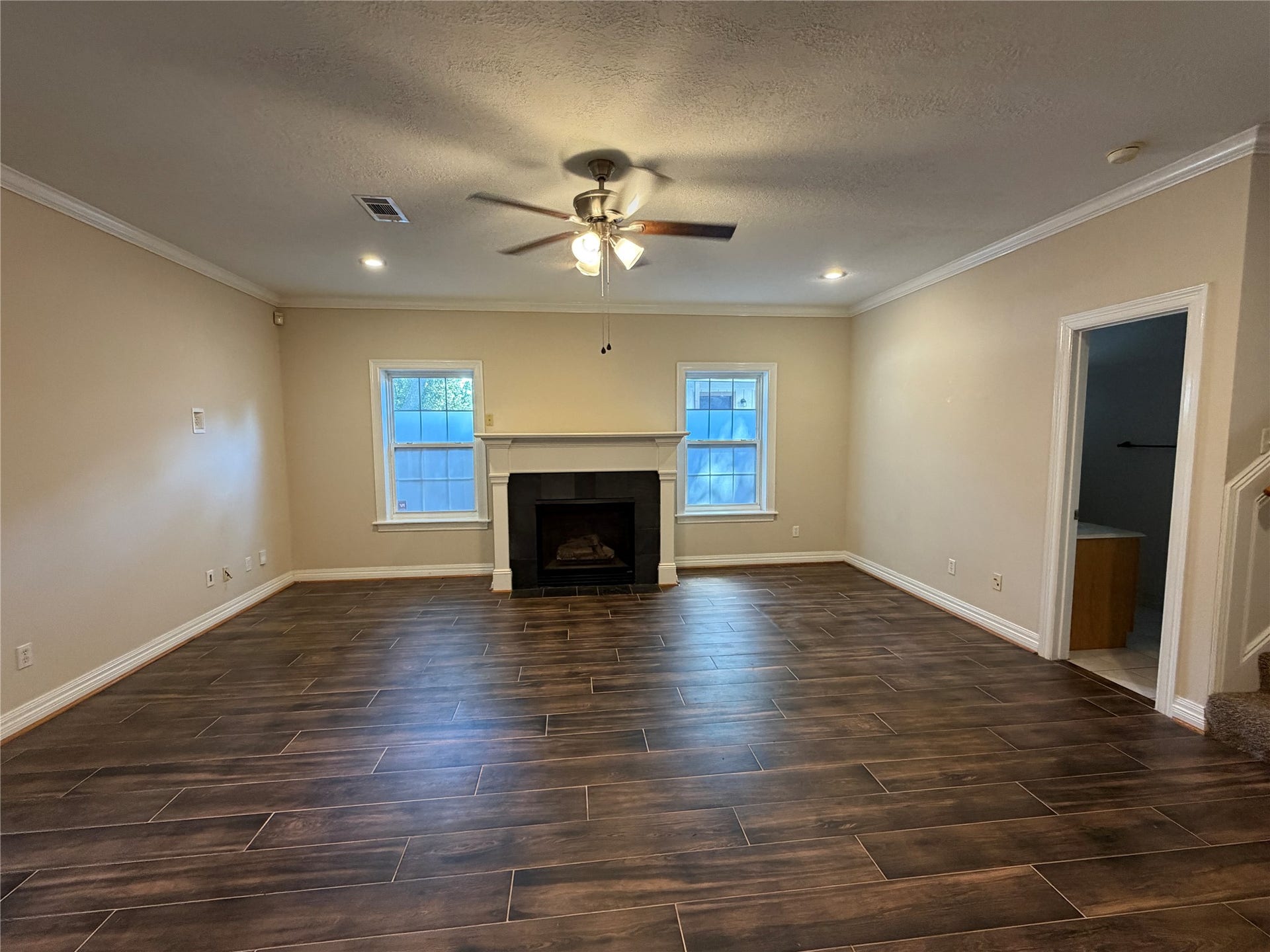 The large living room features a gas log fireplace.