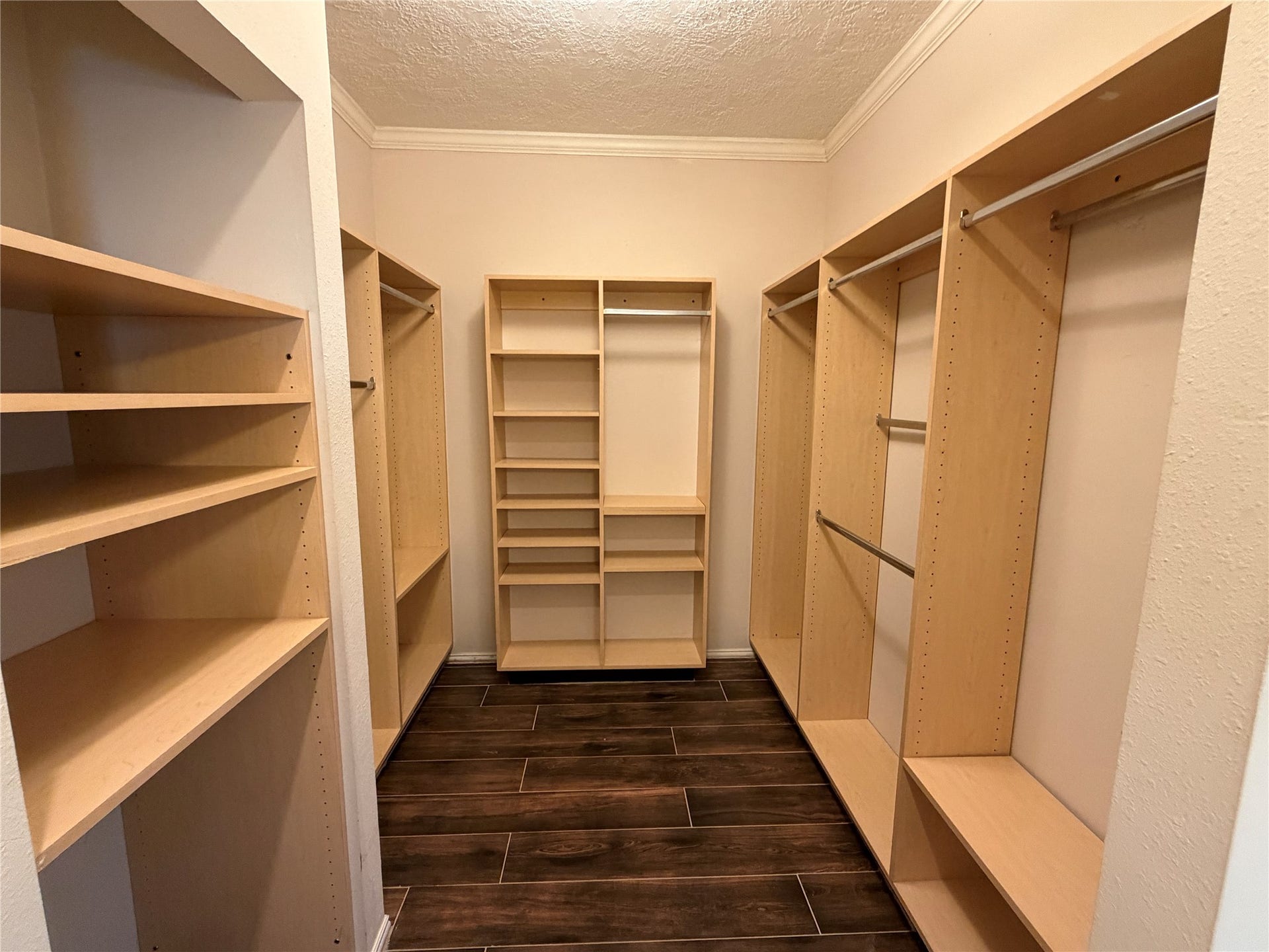 The primary closet has custom built ins with great storage.