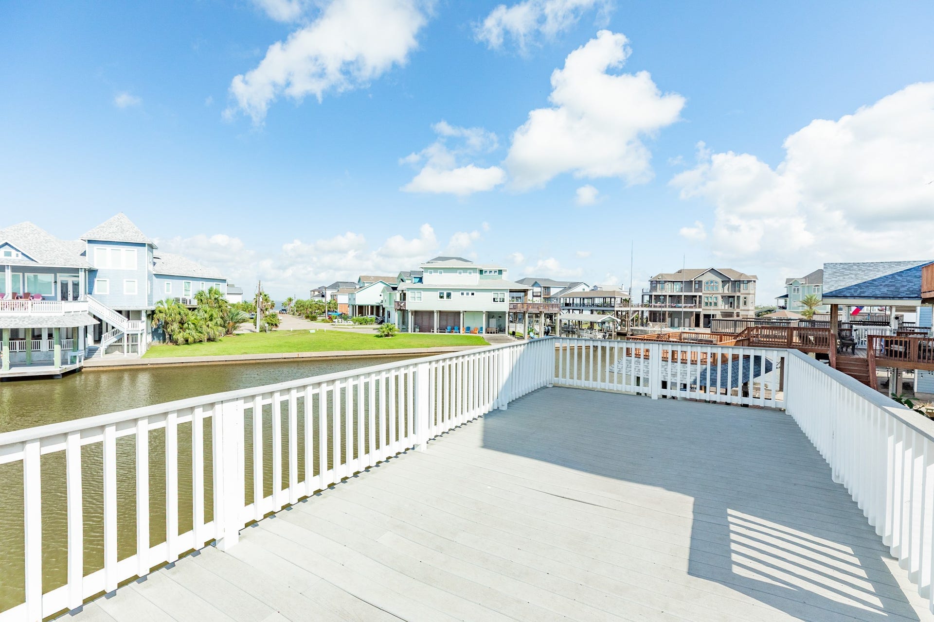 325 Admiral Circle, Tiki Island, TX 77554 Another view of the boat house deck, nice space between you and your neighbor's property at this home.
