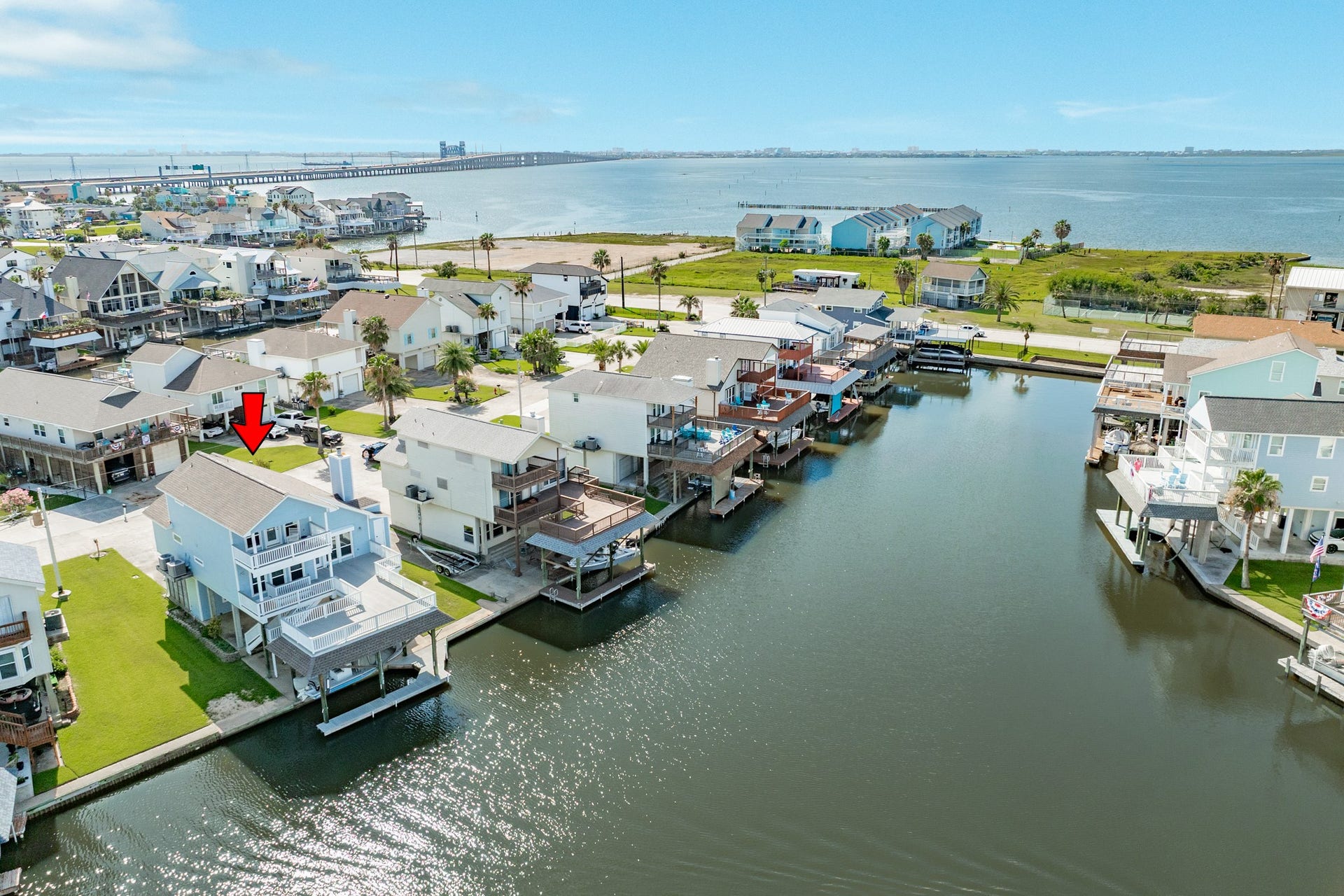 325 Admiral Circle, Tiki Island, TX 77554 Wonderful water views await of West Galveston Bay from the decks of this home.