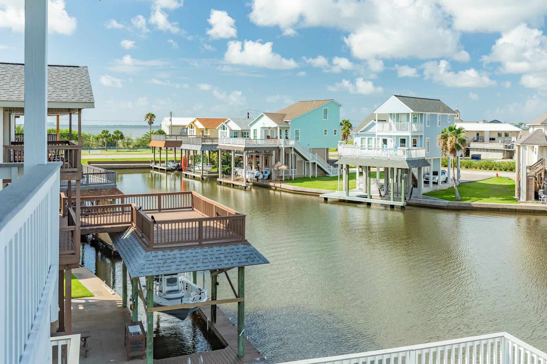 325 Admiral Circle, Tiki Island, TX 77554 Nice wide canal in front, West Bay views to the left and clear pathway to those SW breezes.
