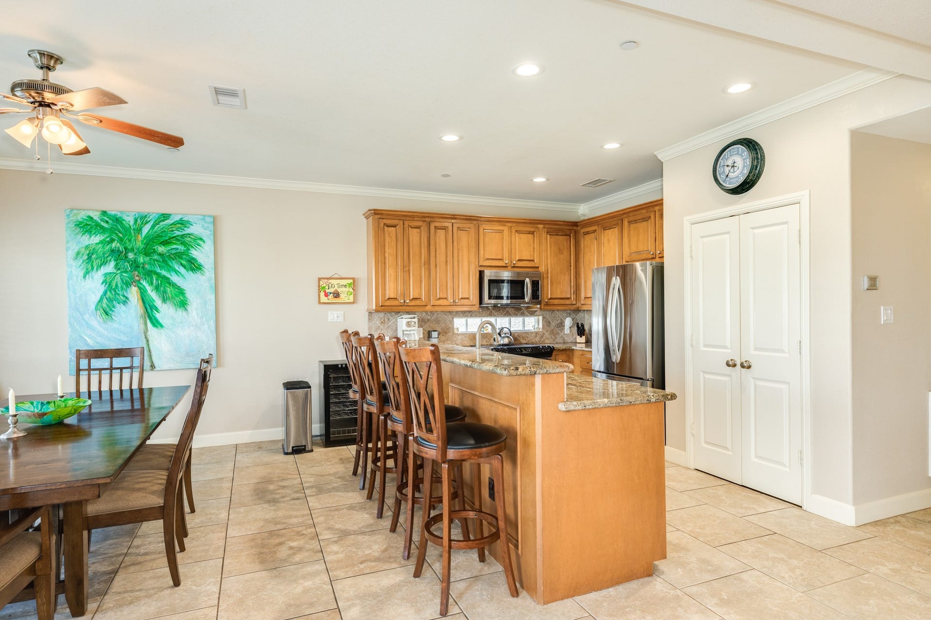 325 Admiral Circle, Tiki Island, TX 77554 Four person breakfast bar, pantry and galley kitchen are well organized in this home.