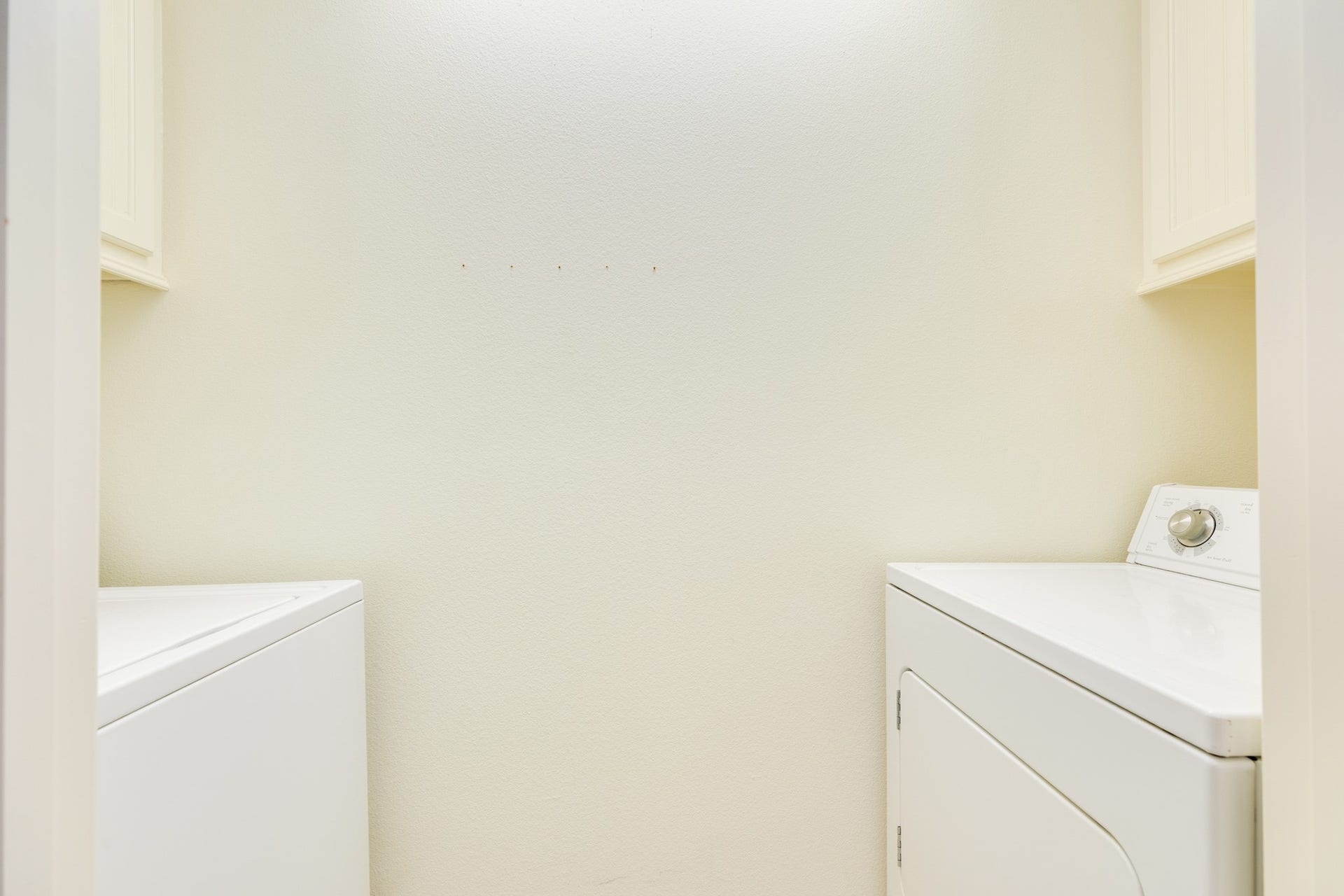 325 Admiral Circle, Tiki Island, TX 77554 Utility closet with electric Clothes Washing & drying machines.