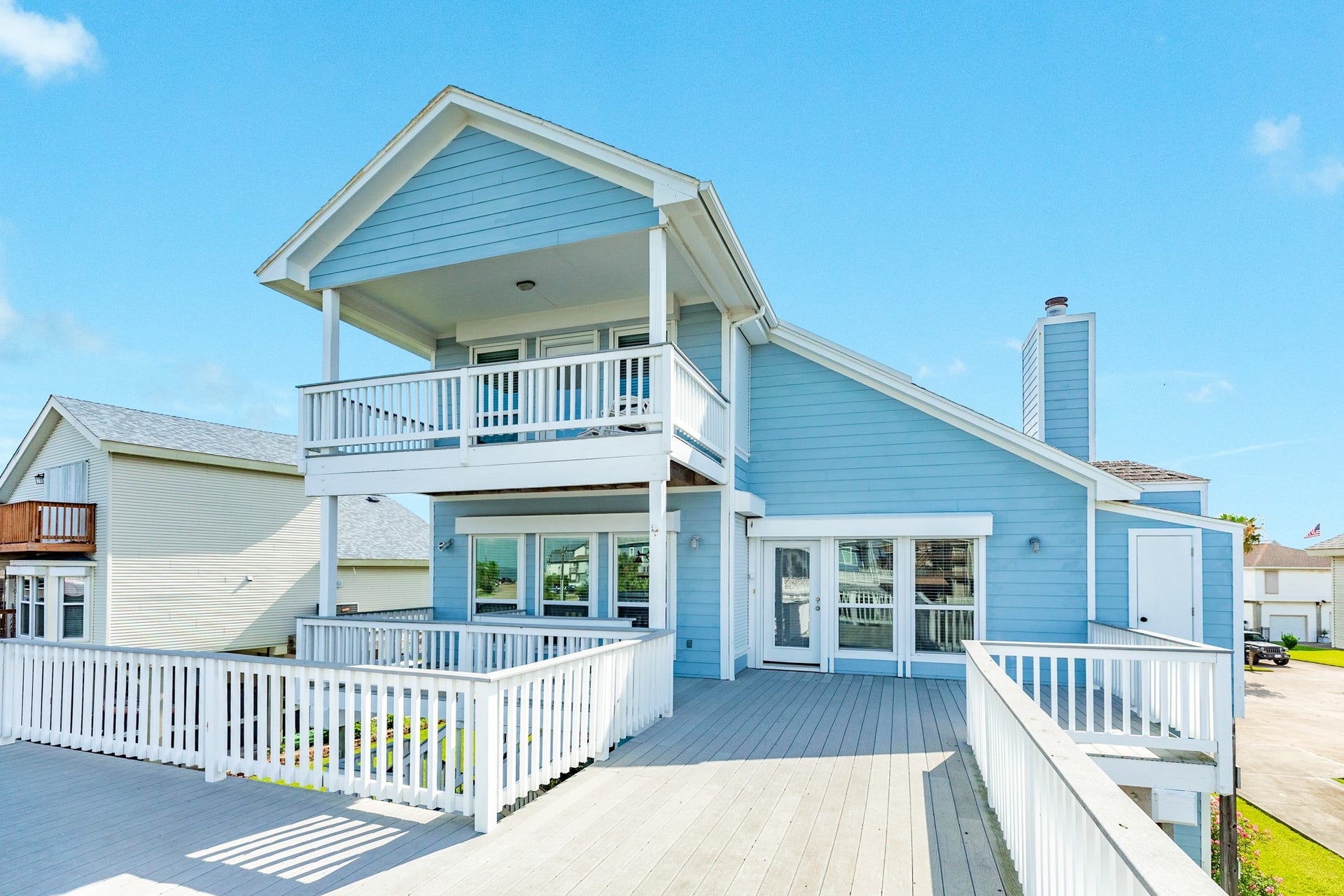 325 Admiral Circle, Tiki Island, TX 77554 The exterior siding is fiber cement siding, double pane windows and doors all covered by rolling shutters (both electric and manual), all deck materials are composite for long life and ease in maintenance.