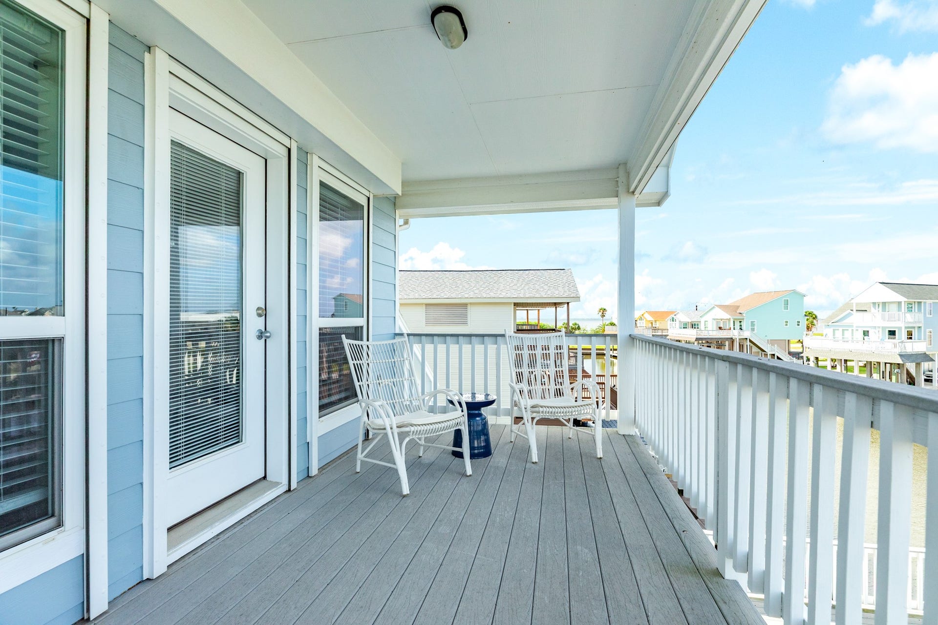 325 Admiral Circle, Tiki Island, TX 77554 The private deck outside of the primary suite is covered and ideal for watching the sunsets over the bay.