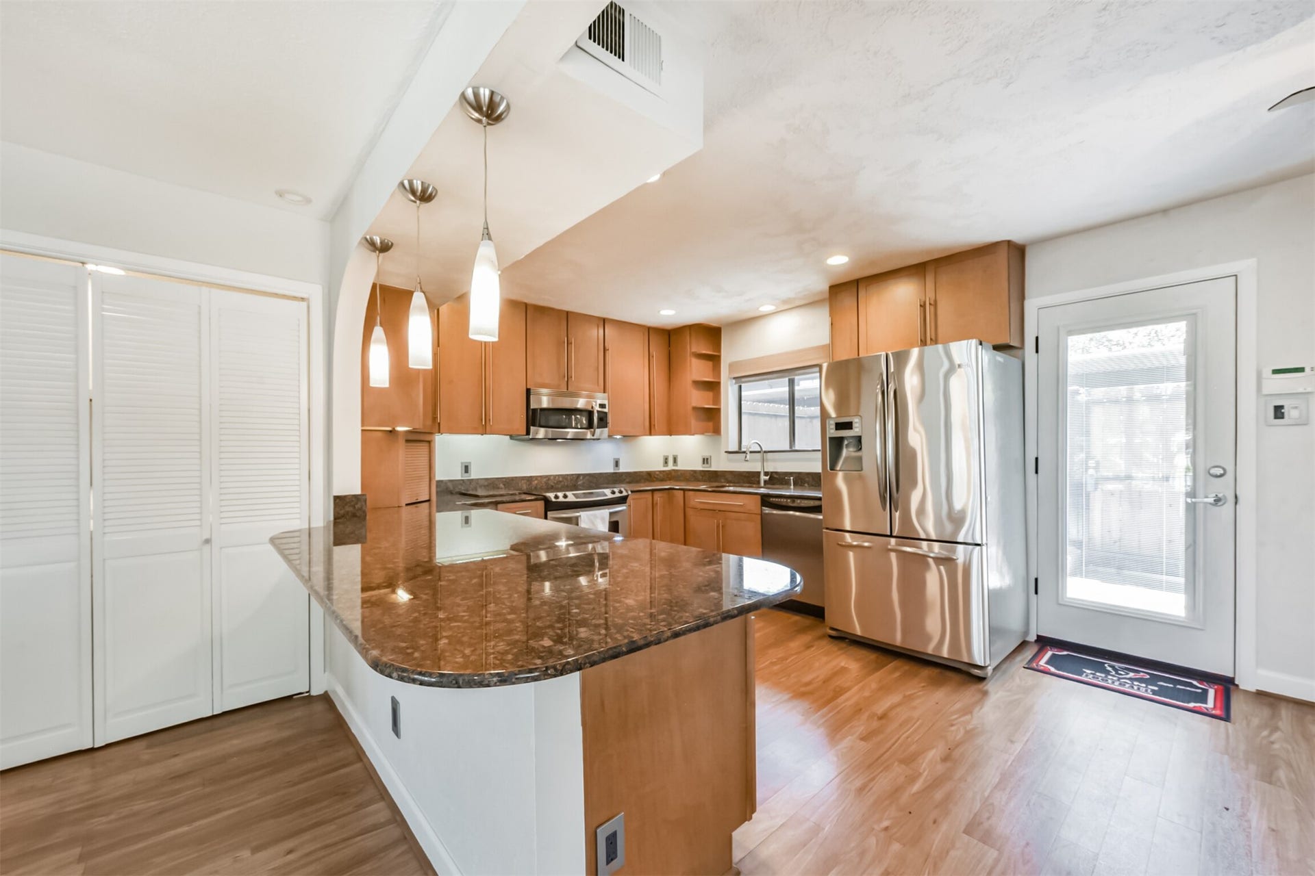 Large open and upgraded kitchen.  Refrigerator stays.  Bi-folding doors hide your in-house laundry area.  Comes with washer and dryer.