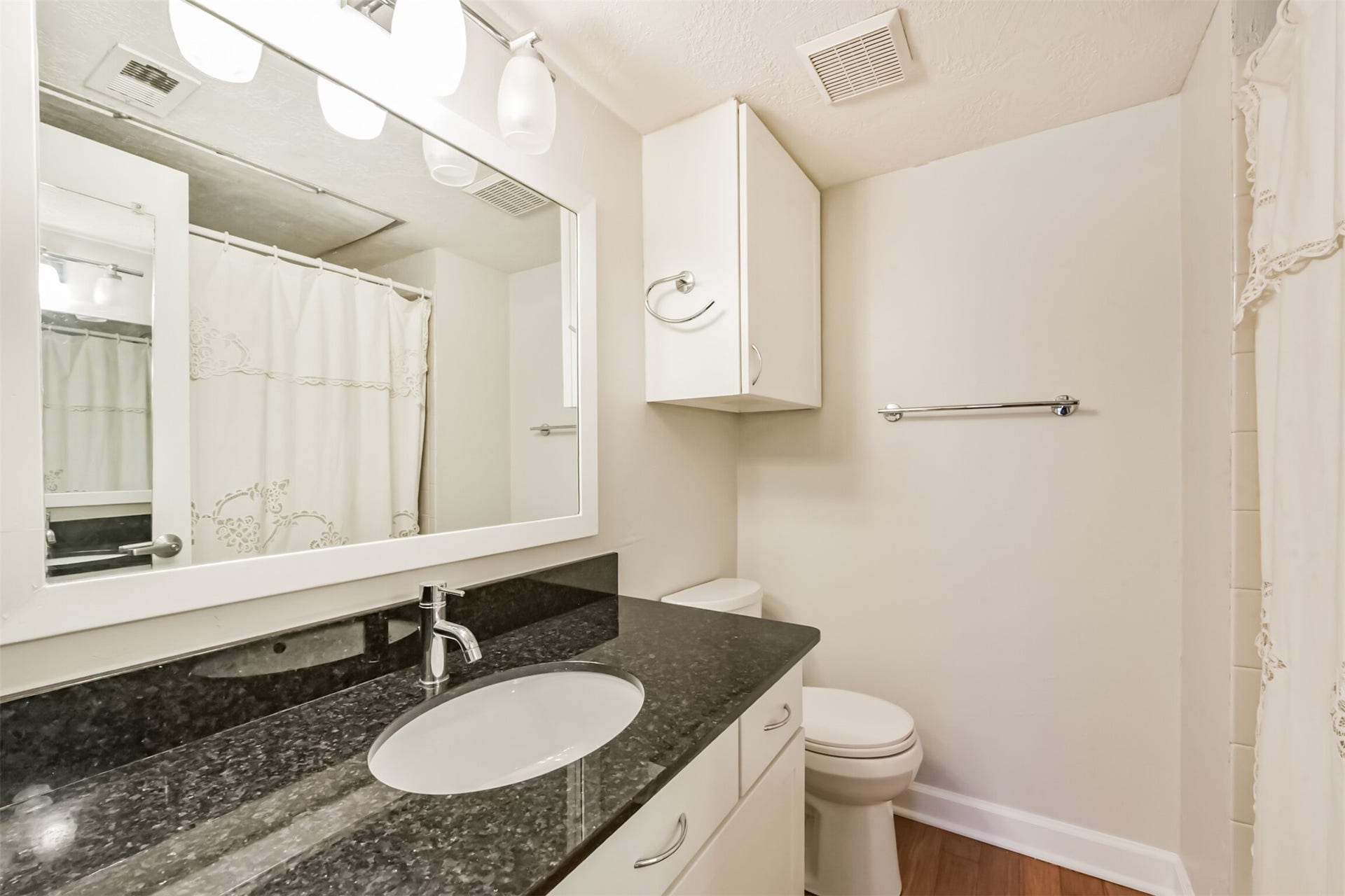 Private bath for bedroom 2, with supersized vanity and  shower/tub
