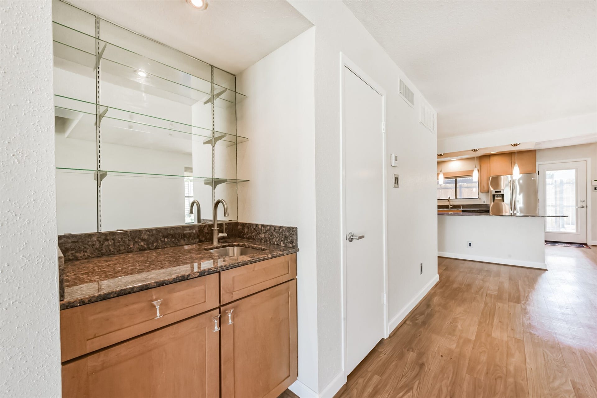 Granite wet bar with martini pulls.  The perfect place for entertaining.