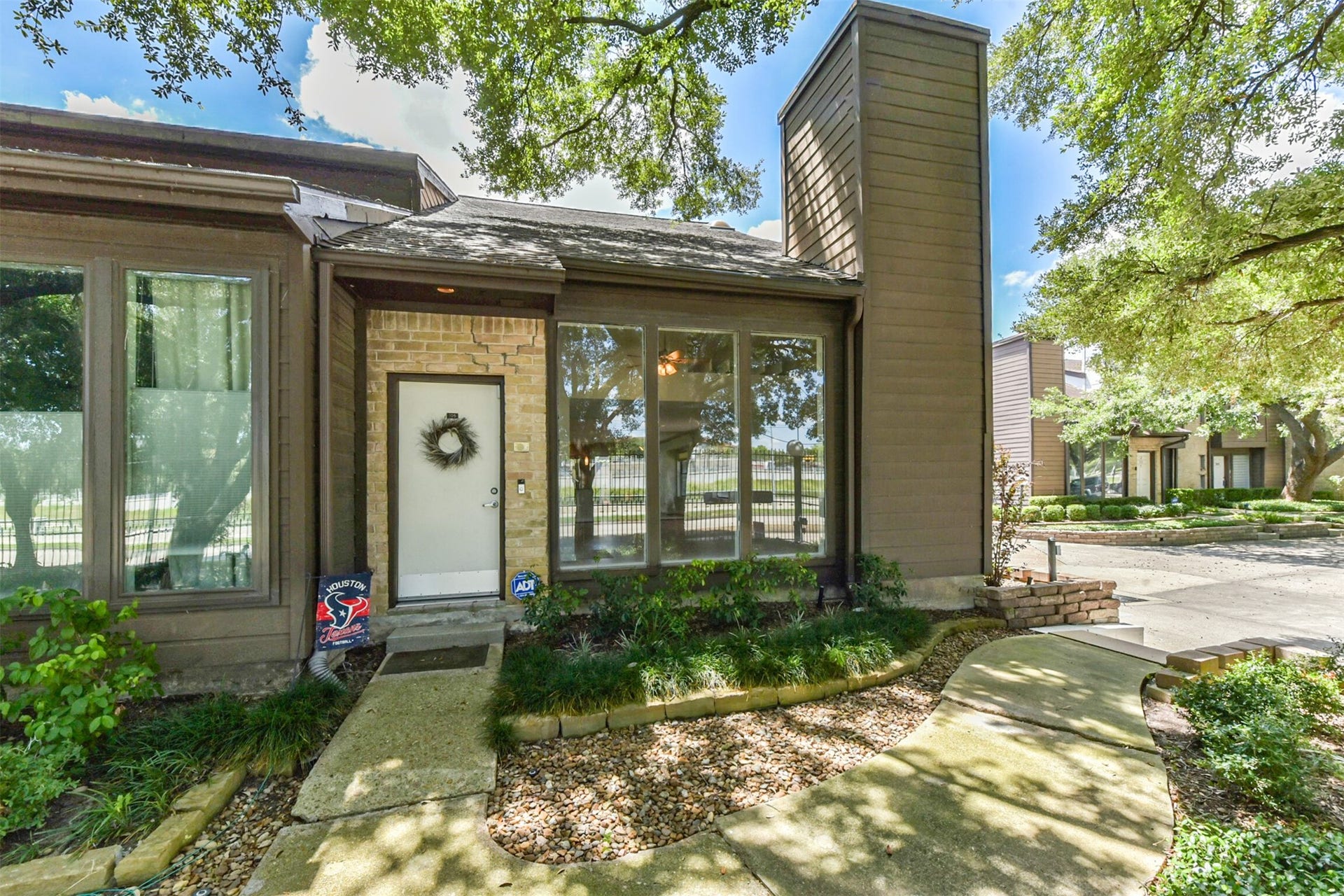 Welcome home!  Beautiful mature oak trees and landscape create a welcoming vibe for all your friends and family.