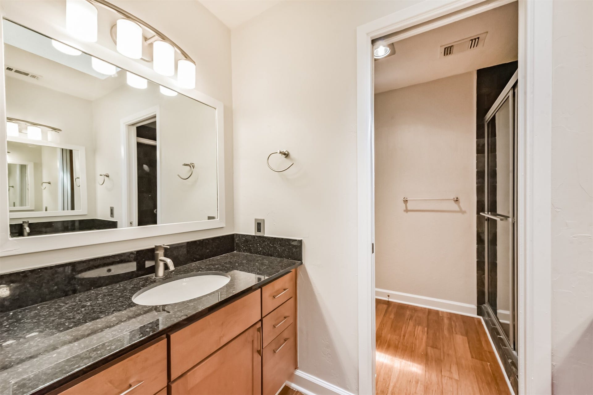 Pocket door separates shower and toilet room from vanities, so you can both be getting ready at the same time and everyone will still have privacy.