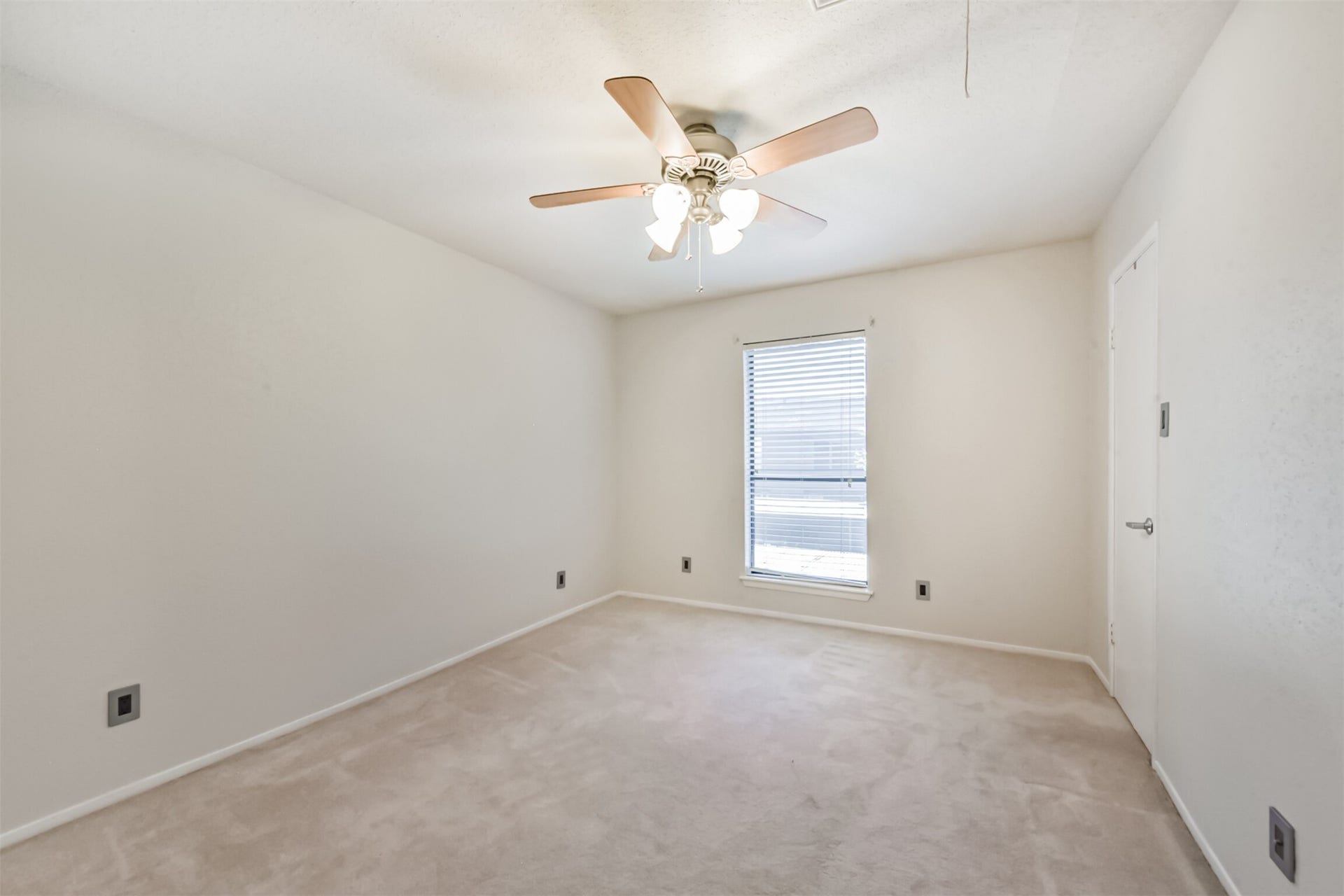 Bedroom 2 with lots of natural light and a generous walk-in closet