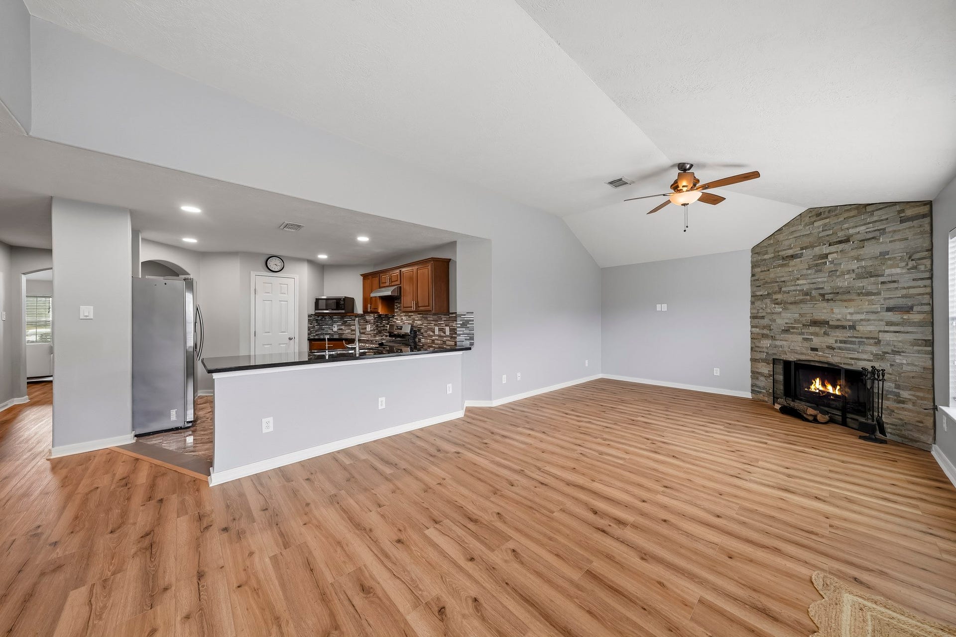 18126 Brightwood Park Lane, Richmond, TX 77407 Open-concept layout provides flexible space for both family area and dining.