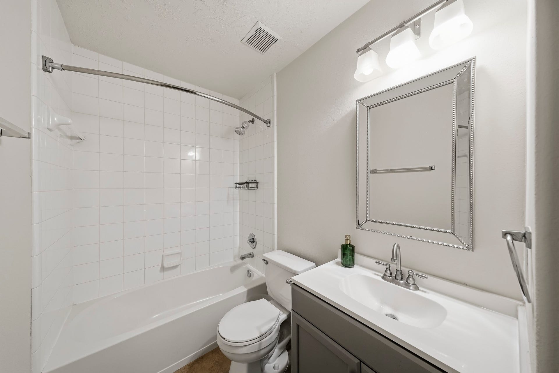 18126 Brightwood Park Lane, Richmond, TX 77407 Updated secondary bath features a clean, modern vanity and neutral finishes.