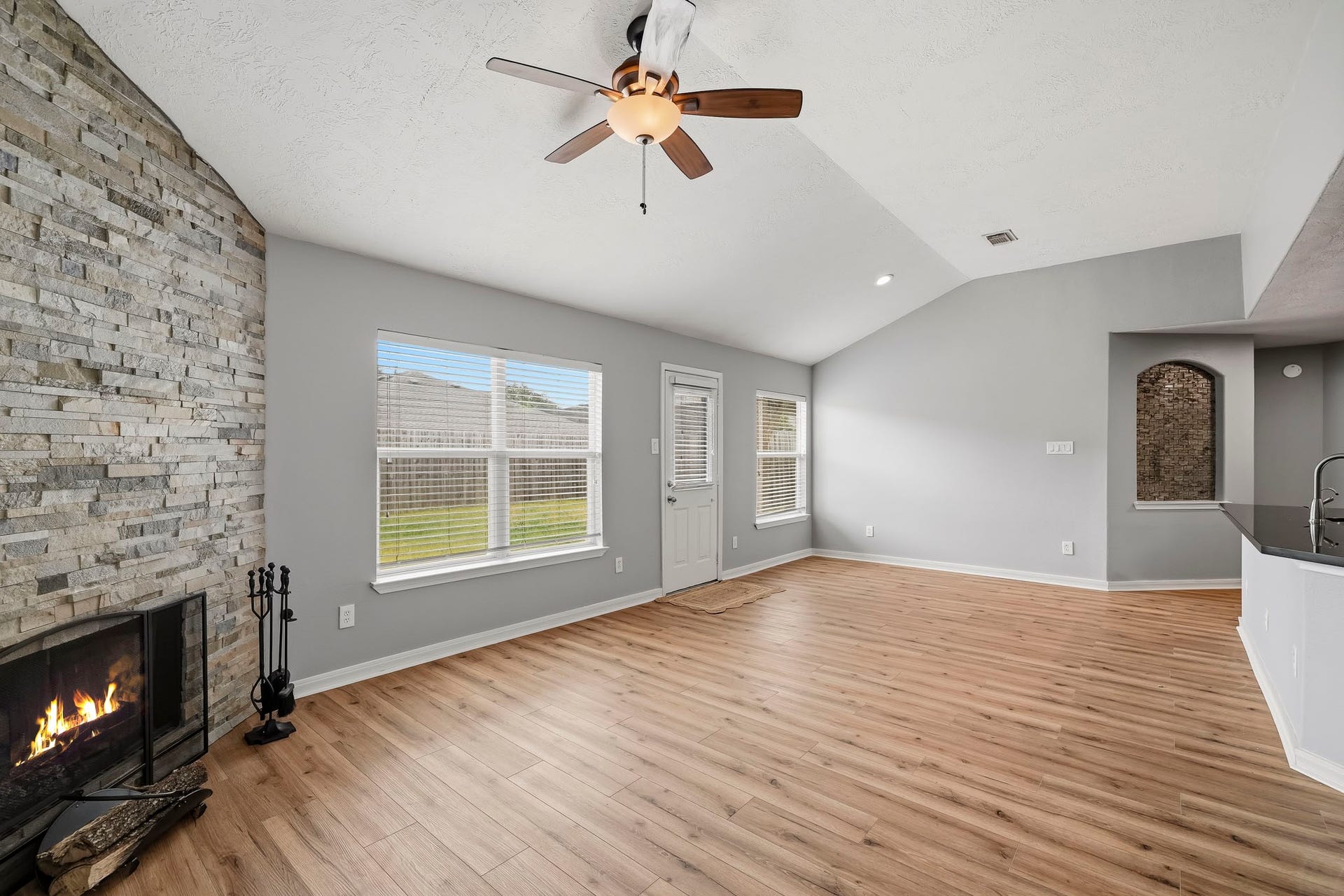 18126 Brightwood Park Lane, Richmond, TX 77407 Generously sized family area offers flexible furniture placement and an easy flow into the adjoining spaces.