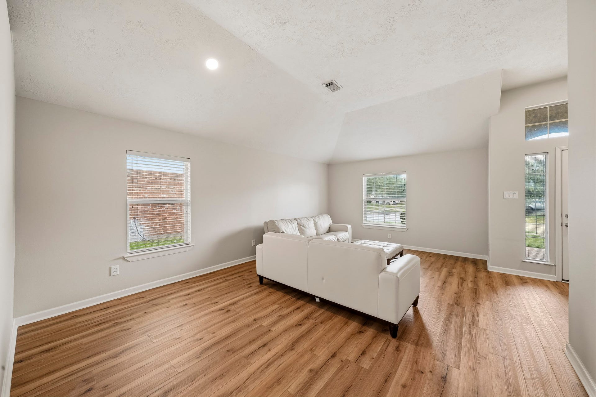 18126 Brightwood Park Lane, Richmond, TX 77407 Spacious flex area features warm flooring and multiple windows for natural light.