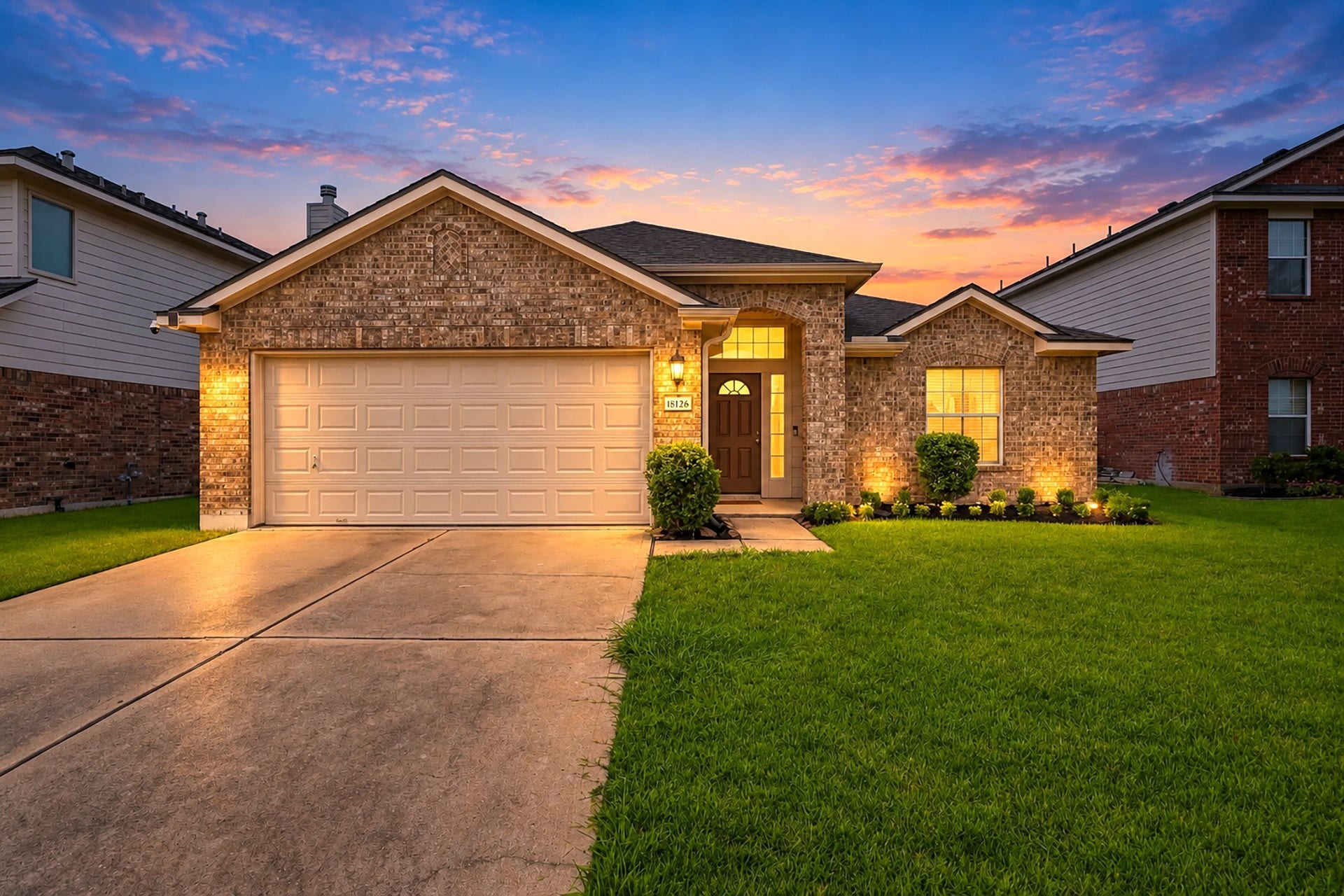 18126 Brightwood Park Lane, Richmond, TX 77407 Charming single-story brick home with an attached two-car garage and welcoming curb appeal.