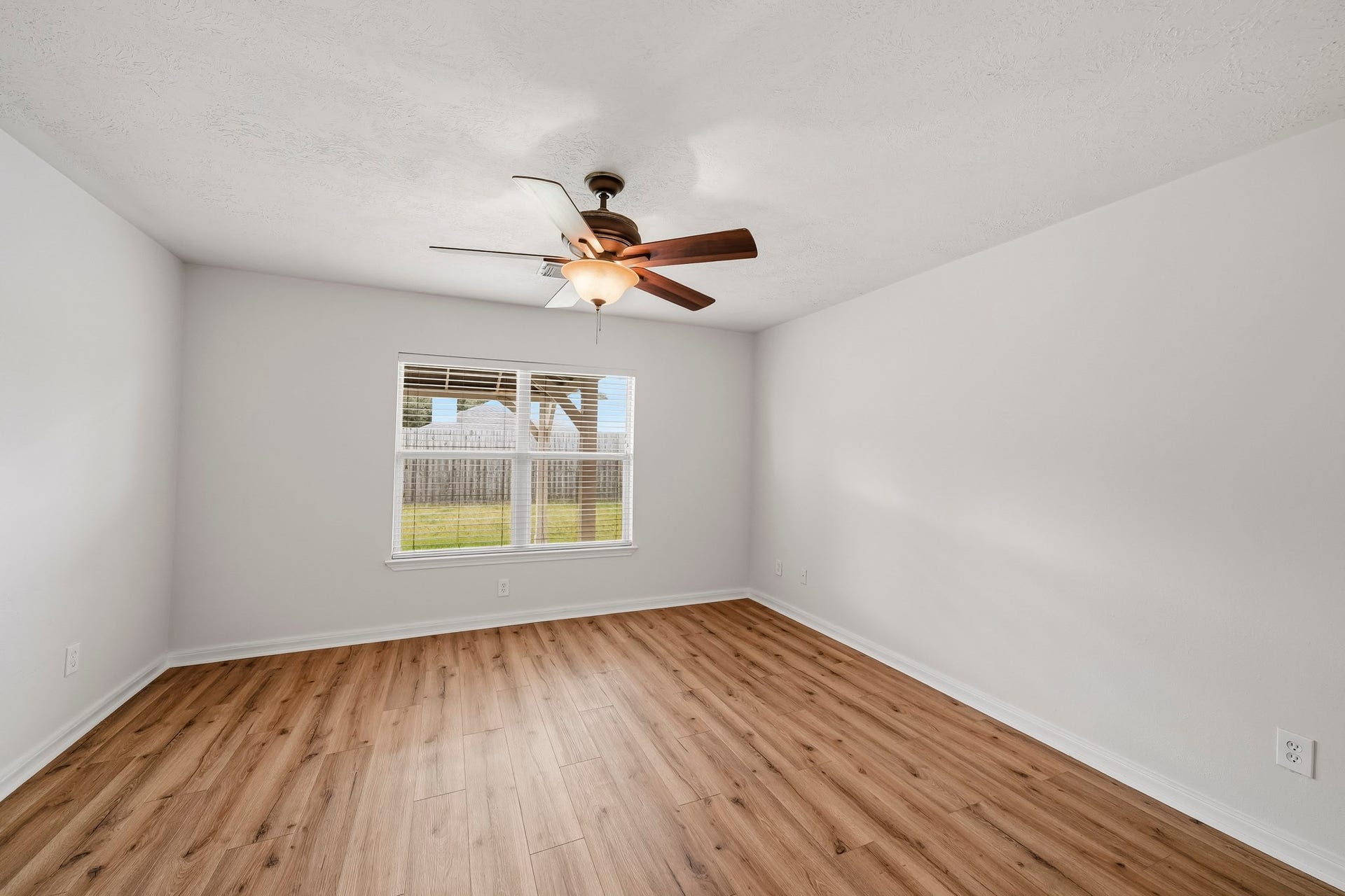 18126 Brightwood Park Lane, Richmond, TX 77407 Primary suite offers a comfortable footprint with room for multiple furniture arrangements.