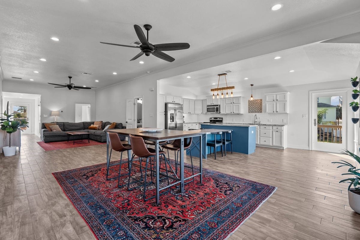 Grand Entry showcasing extra large living space with open kitchen, living room and breakfast area. Bar stool type seating with extension off island! Great Space with lots of Natural Lighting throughout!!
