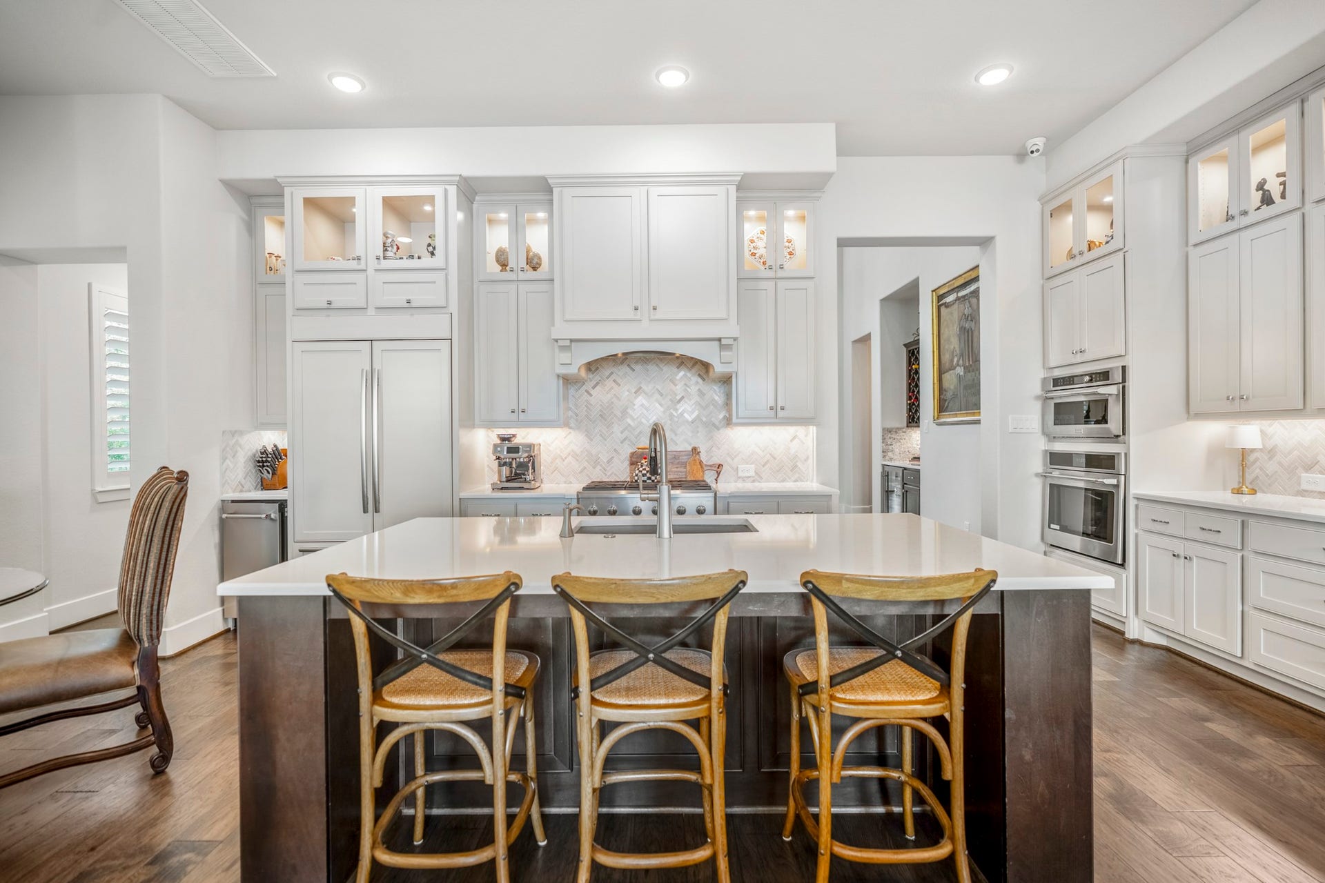 Everything you need is here...2 ovens, a convection/microwave, 6 burner gas stove, ice maker, large sink in the island, and smaller sink in the bar area.