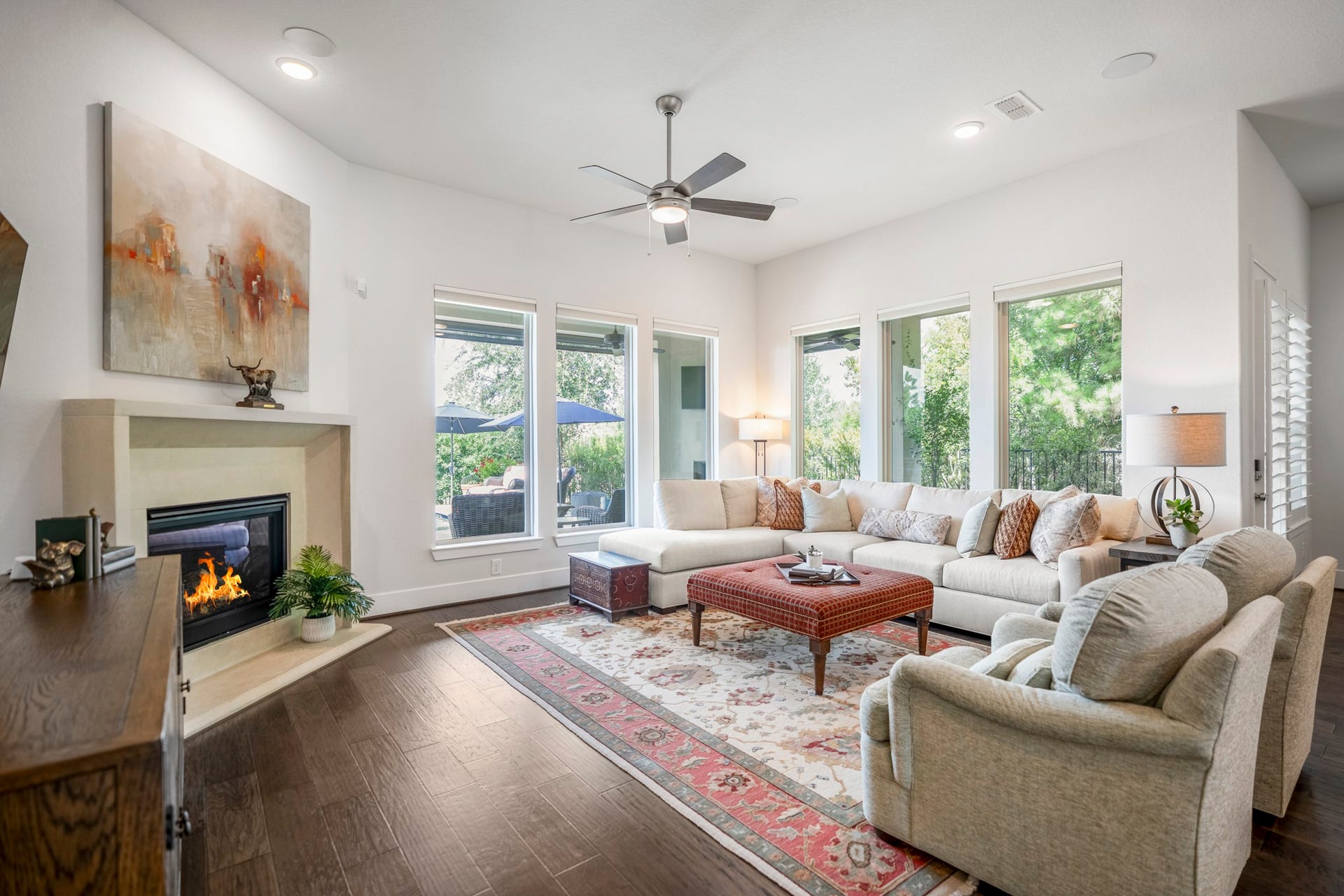 In the living room you'll find a gaslog fireplace, elegant windows with Hunter Douglas remote shades, and a fantastic water view!