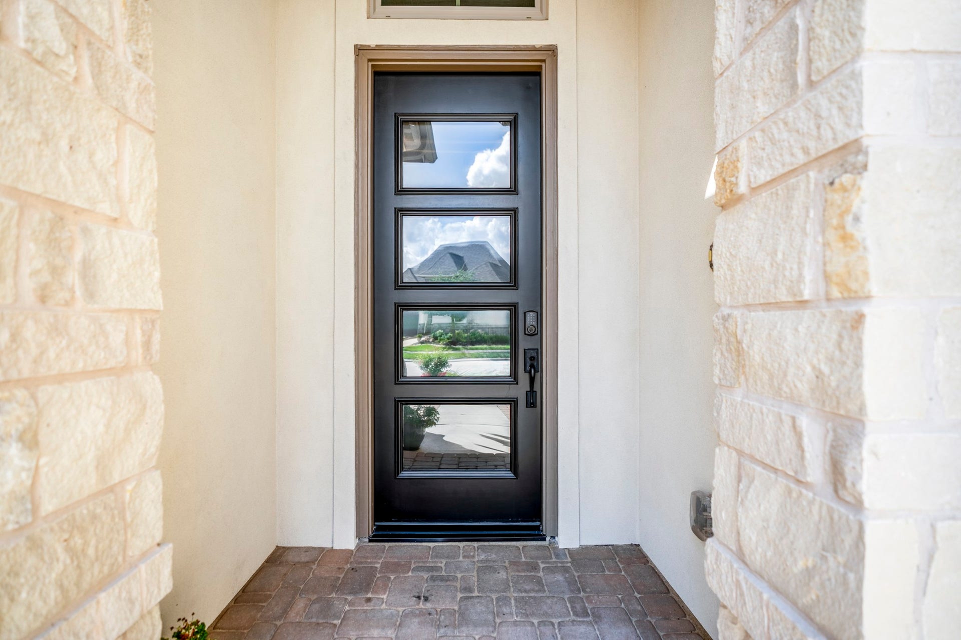 You enter the home thru the stone and stucco covered entry...