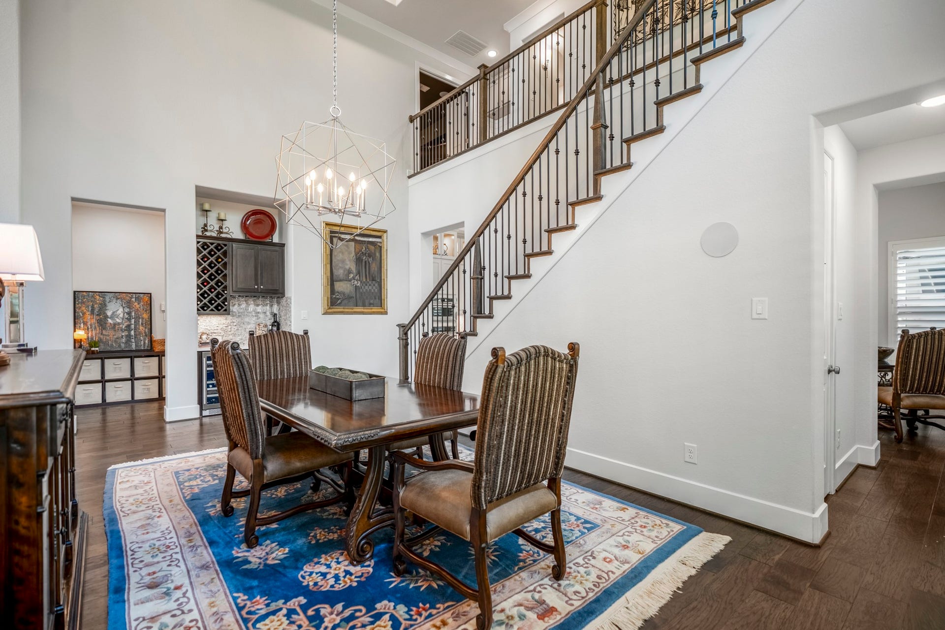 The other end of the dining space shows the butler's pantry/ bar area with wine chiller, and wine and wine glass storage.
