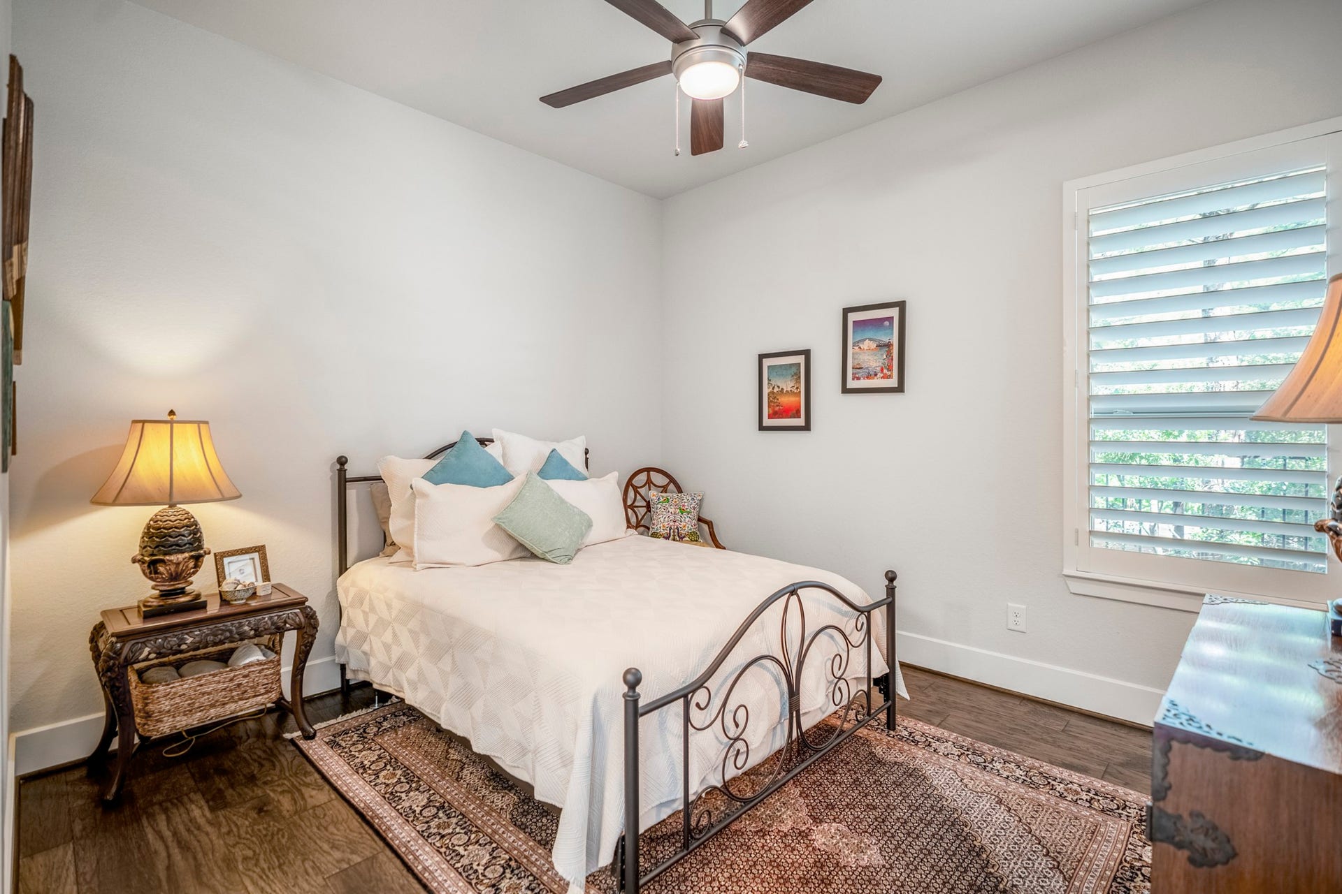 This bedroom is also on the first floor, and also has a walk-in closet, plantation shutters and ensuite bath with shower