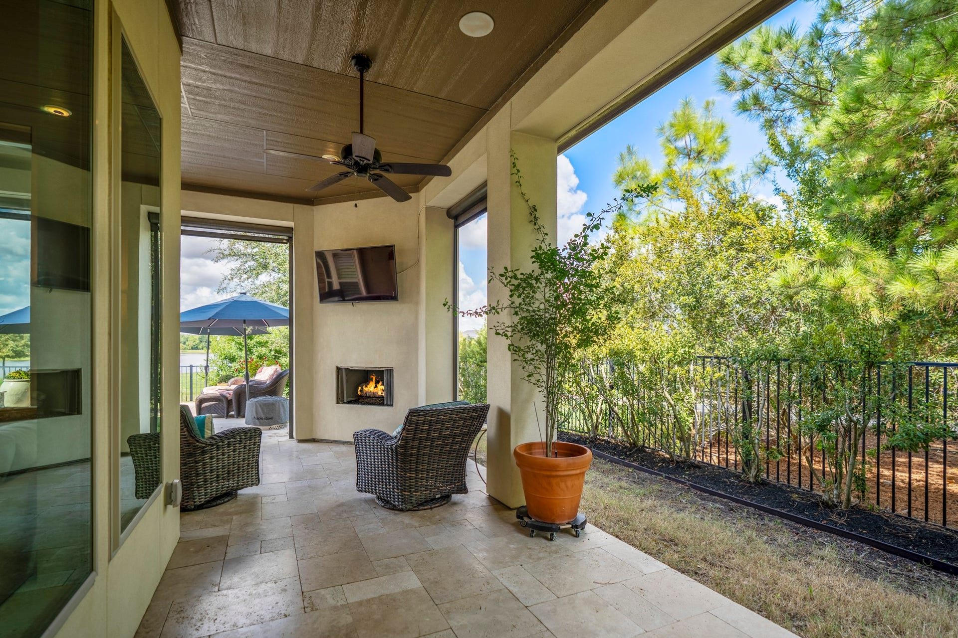 The travertine wraps the whole outside space.  The fence is wrought iron, for the views.