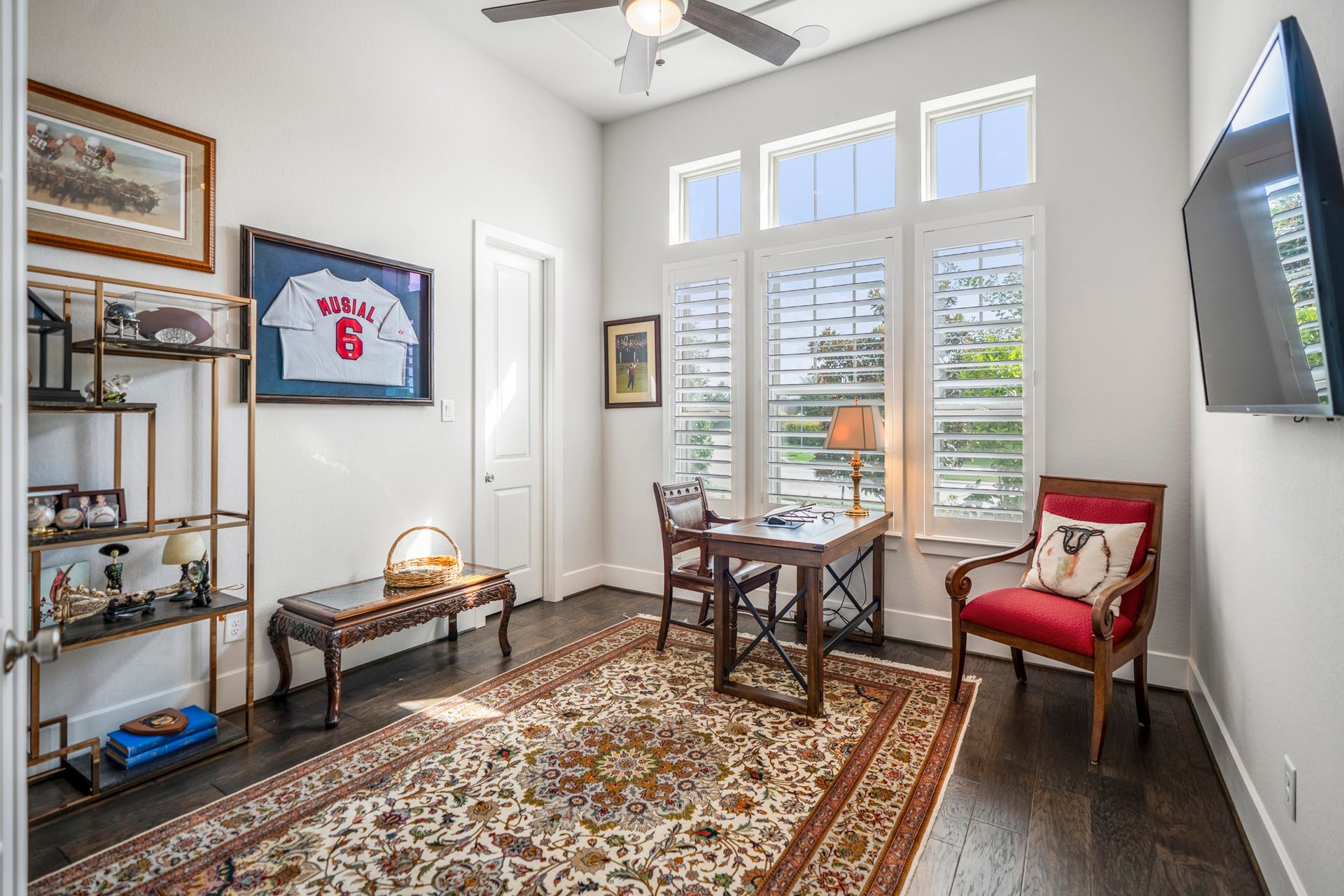 This first floor bedroom with Plantation shutters also has a walk-in closet.  The current owners are using this as a study.