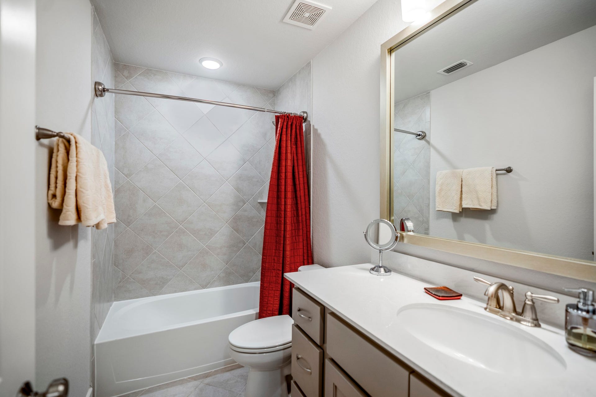 This full bath is located upstairs and next to the bedroom.  Convenient for the media room as well.