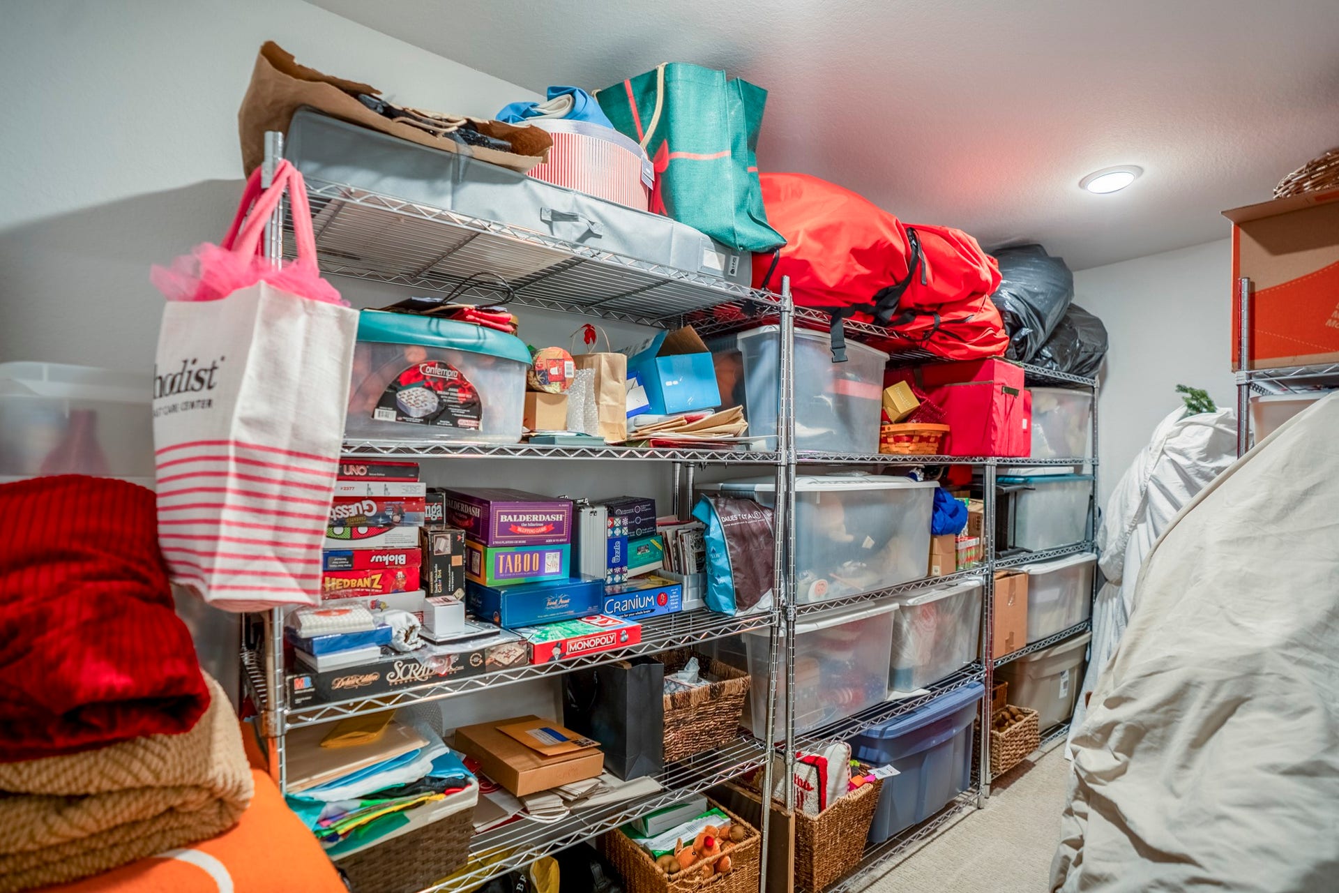 This air conditioned 5x14 closet is additional air conditioned space behind the far wall of the media room.  No need to drag things up to the attic.