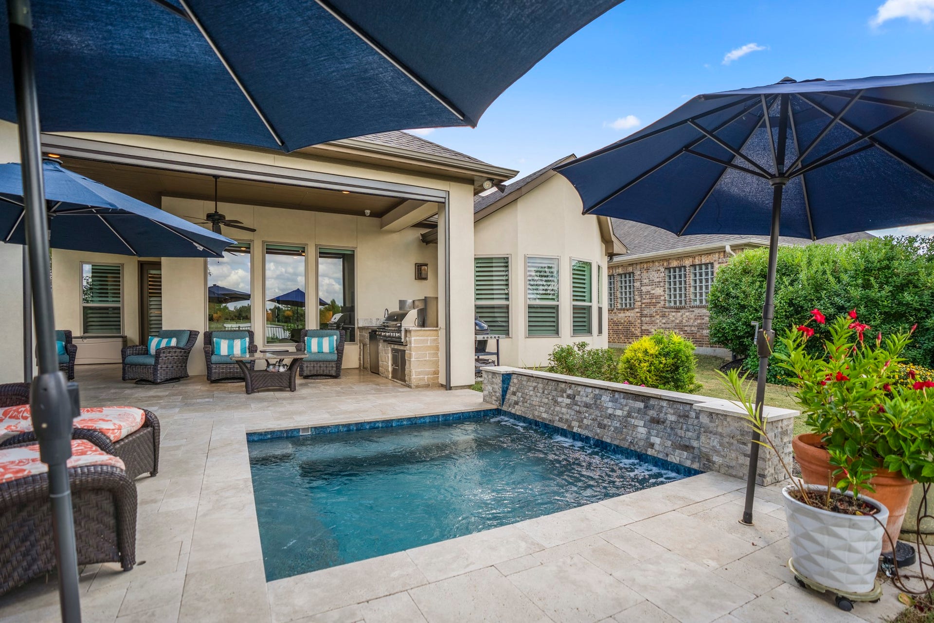You will LOVE the SPOOL!!!  The saltwater spa-pool is 10x10 with bench seating, and waterfall water feature, and holes in the travertine for your umbrellas...no need to drag umbrella stands around.