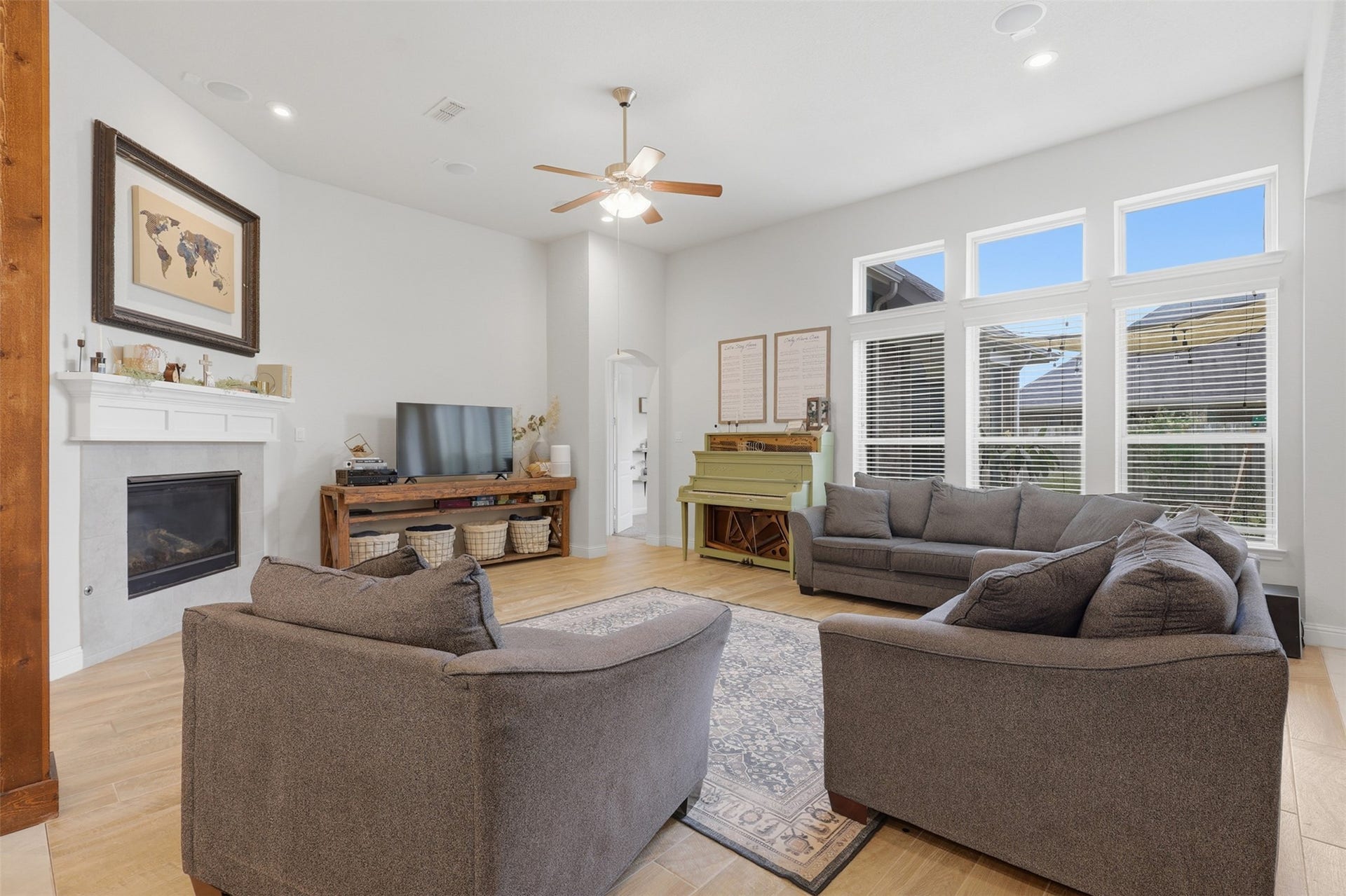 29622 Pewter Run Lane, Katy, TX 77494 Expansive living room featuring a cozy fireplace and tall ceilings.
