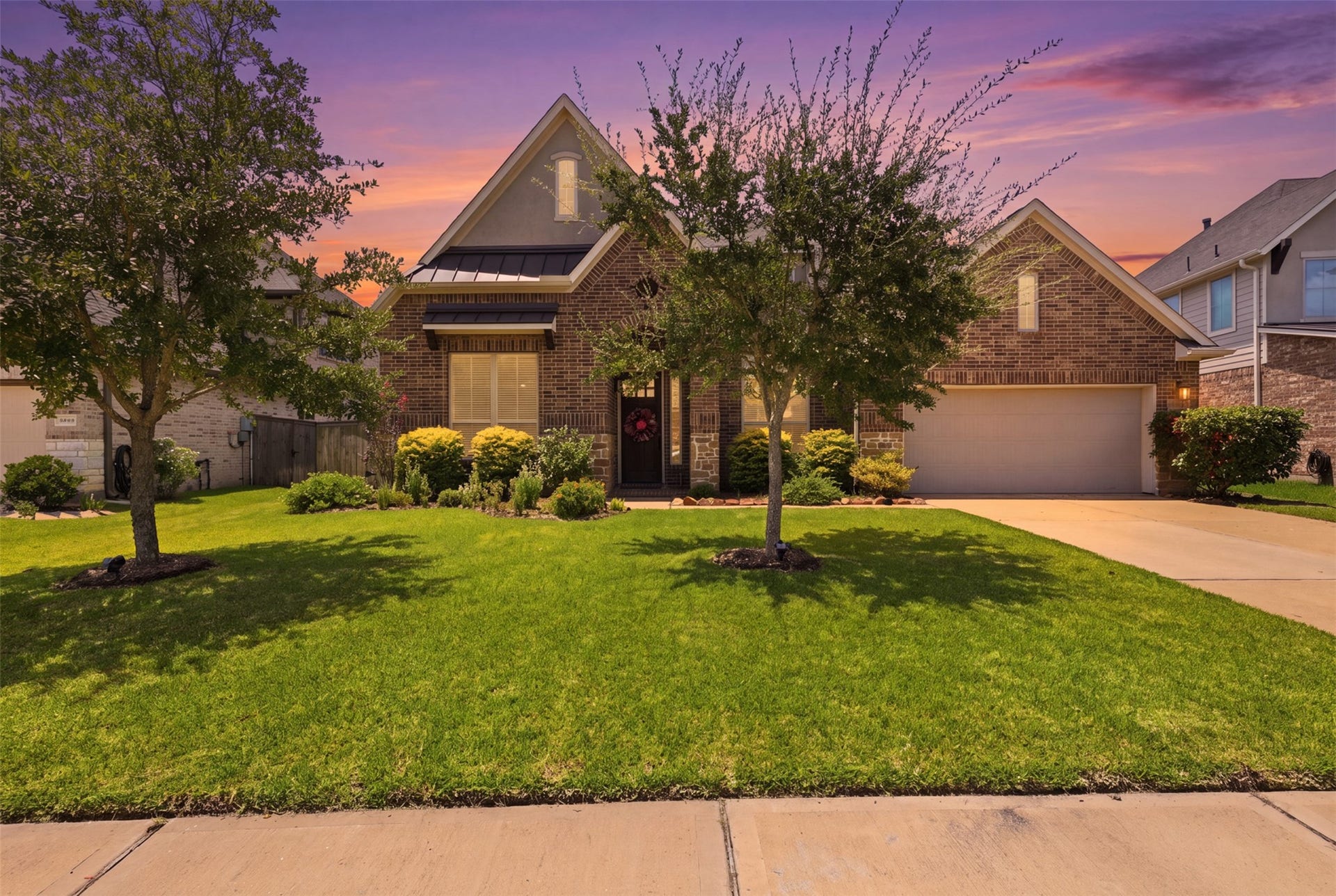 29622 Pewter Run Lane, Katy, TX 77494 Beautiful brick and stone exterior with mature landscaping and oversized driveway.