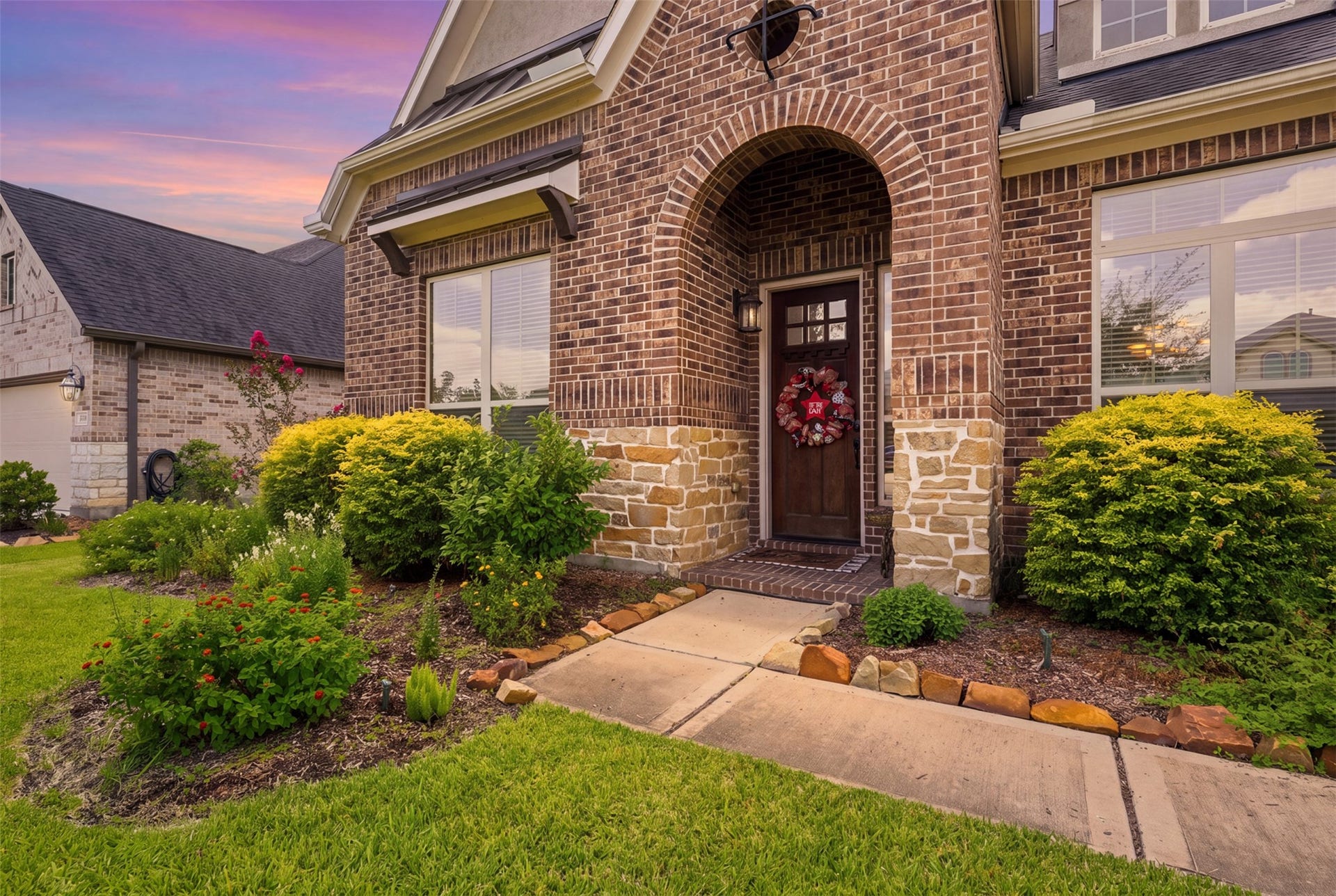 29622 Pewter Run Lane, Katy, TX 77494 Covered front porch with elegant brick archway.