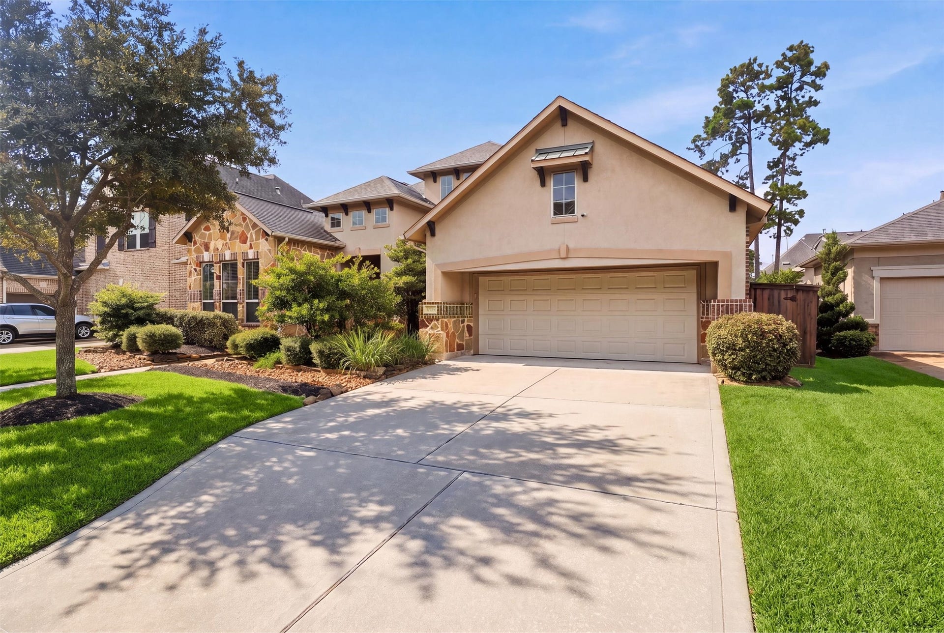 17215 Sages Ravine Drive, Humble, TX 77346 Stone-and-stucco exterior with a welcoming covered entry
