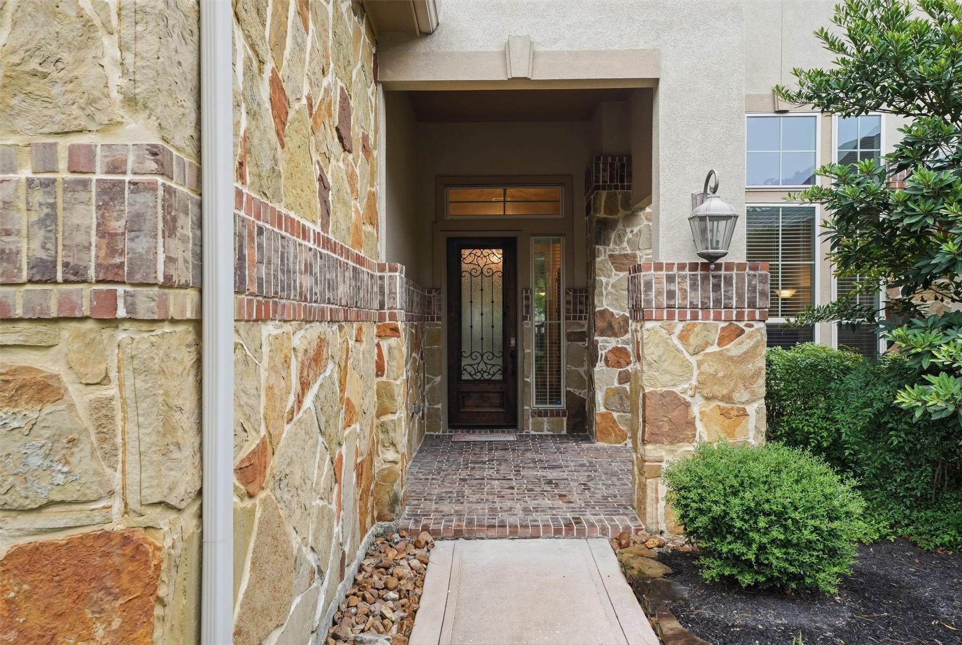 17215 Sages Ravine Drive, Humble, TX 77346 Beautiful Stone work leads you to a welcoming covered front porch.