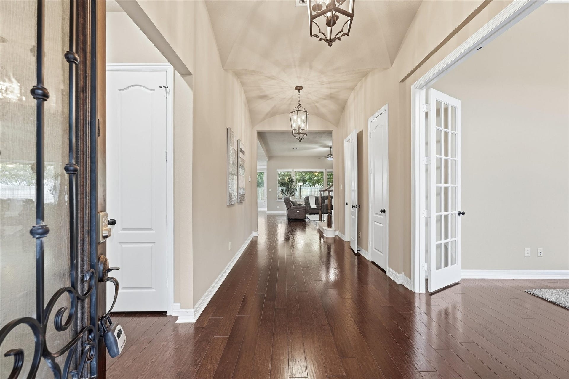 17215 Sages Ravine Drive, Humble, TX 77346 Dramatic barrel-ceiling entry with Private Home Office on right and Hallway to Secondary Bedrooms on Left.