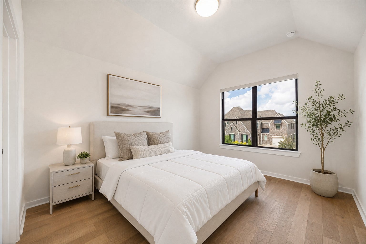 BEDROOM 5 OFFERS A HIGH CEILING, WOOD FLOORING, AND AN OVERSIZED WINDOW WITH NEIGHBORHOOD VIEWS. **Virtually Staged.