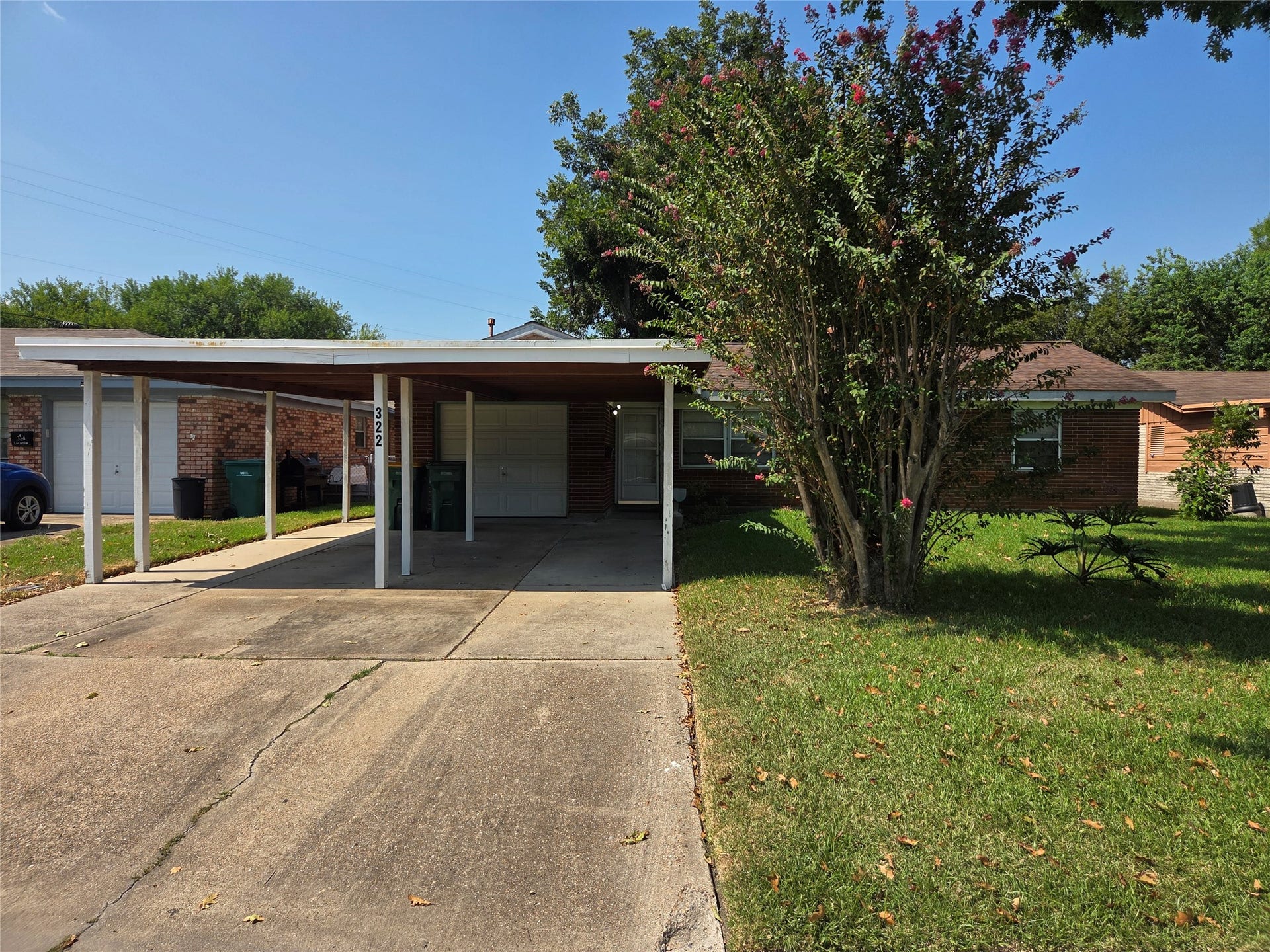 322 Elaine Street, La Marque, TX 77568 Nice large 2 car carport