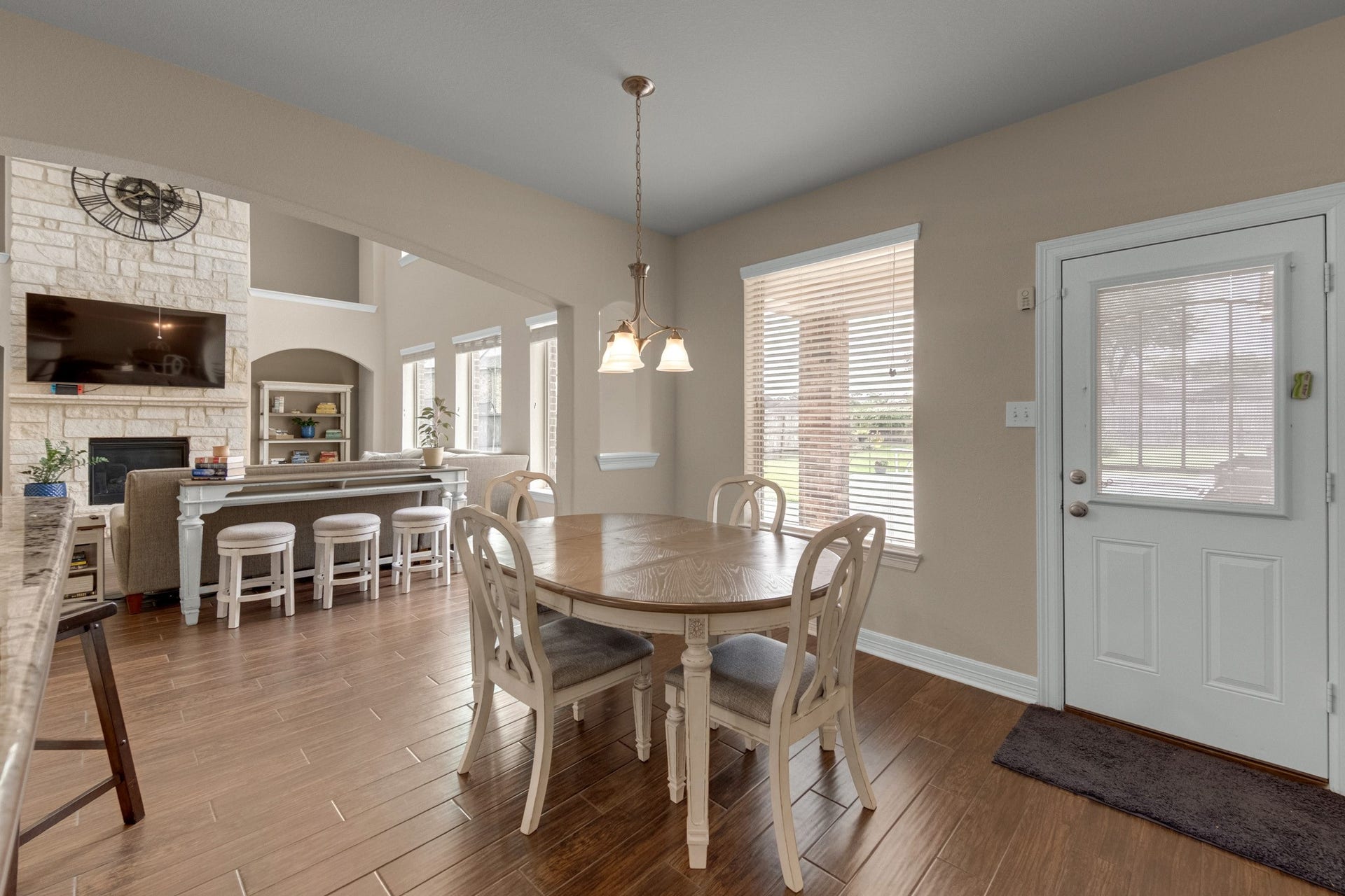 440 Old Orchard Court, Dickinson, TX 77539 The breakfast room sits in a bright corner with a window bank over the backyard and a door to the patio - the everyday counterpart to the formal dining room.