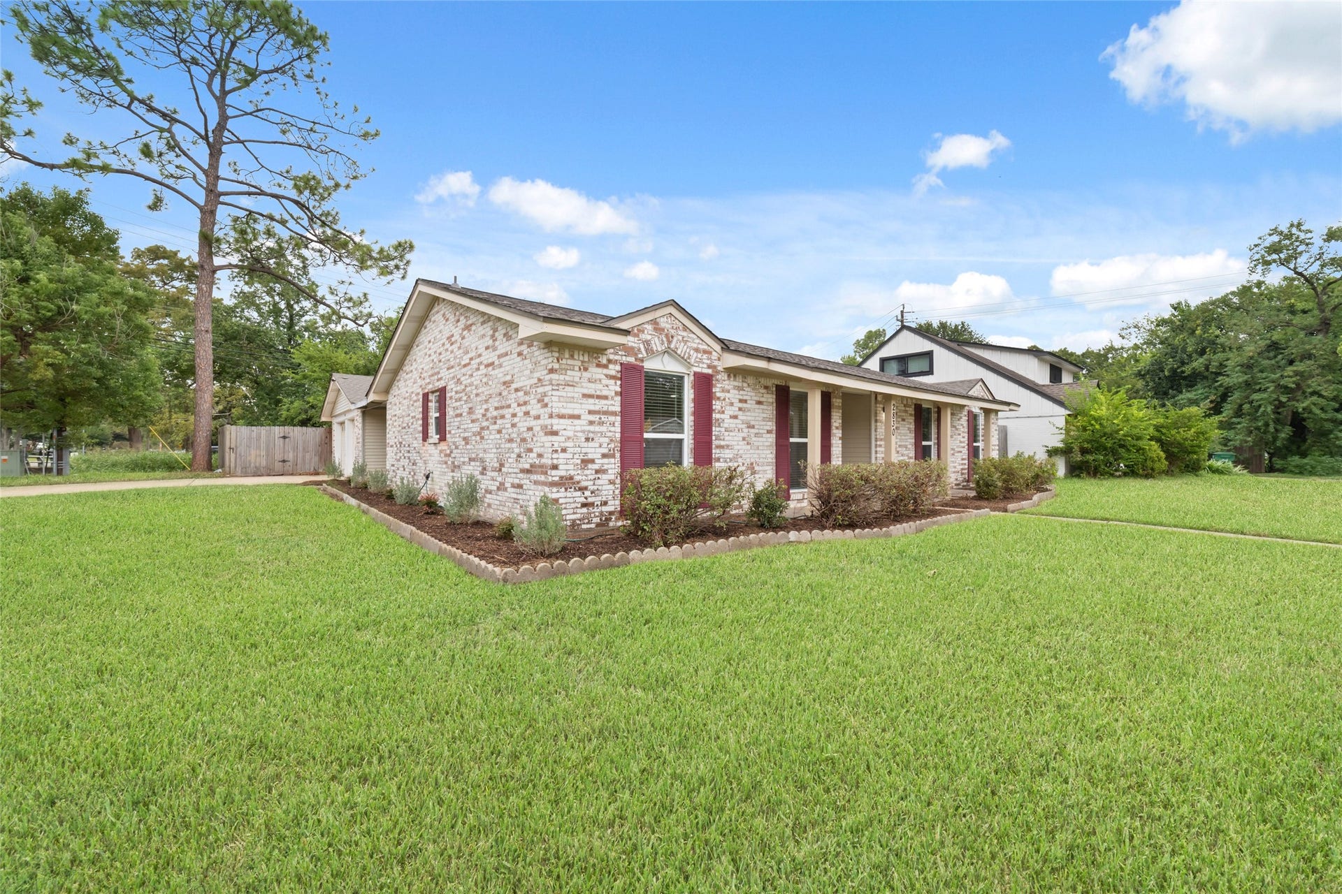 2830 Westerland Drive, Houston, TX 77063 A corner lot with a lovely stretch of lawn and room to put down roots.
