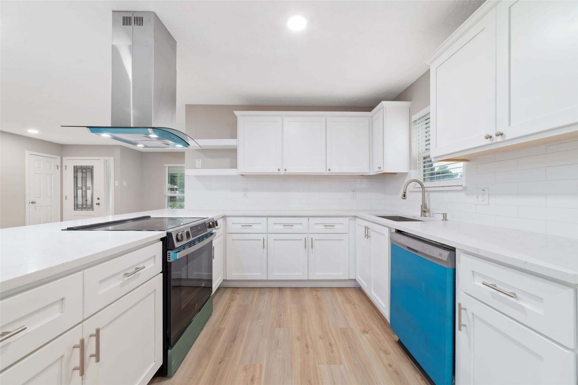 2830 Westerland Drive, Houston, TX 77063 White cabinetry lets your copper pots, colorful dishes and bowl of lemons steal the show.