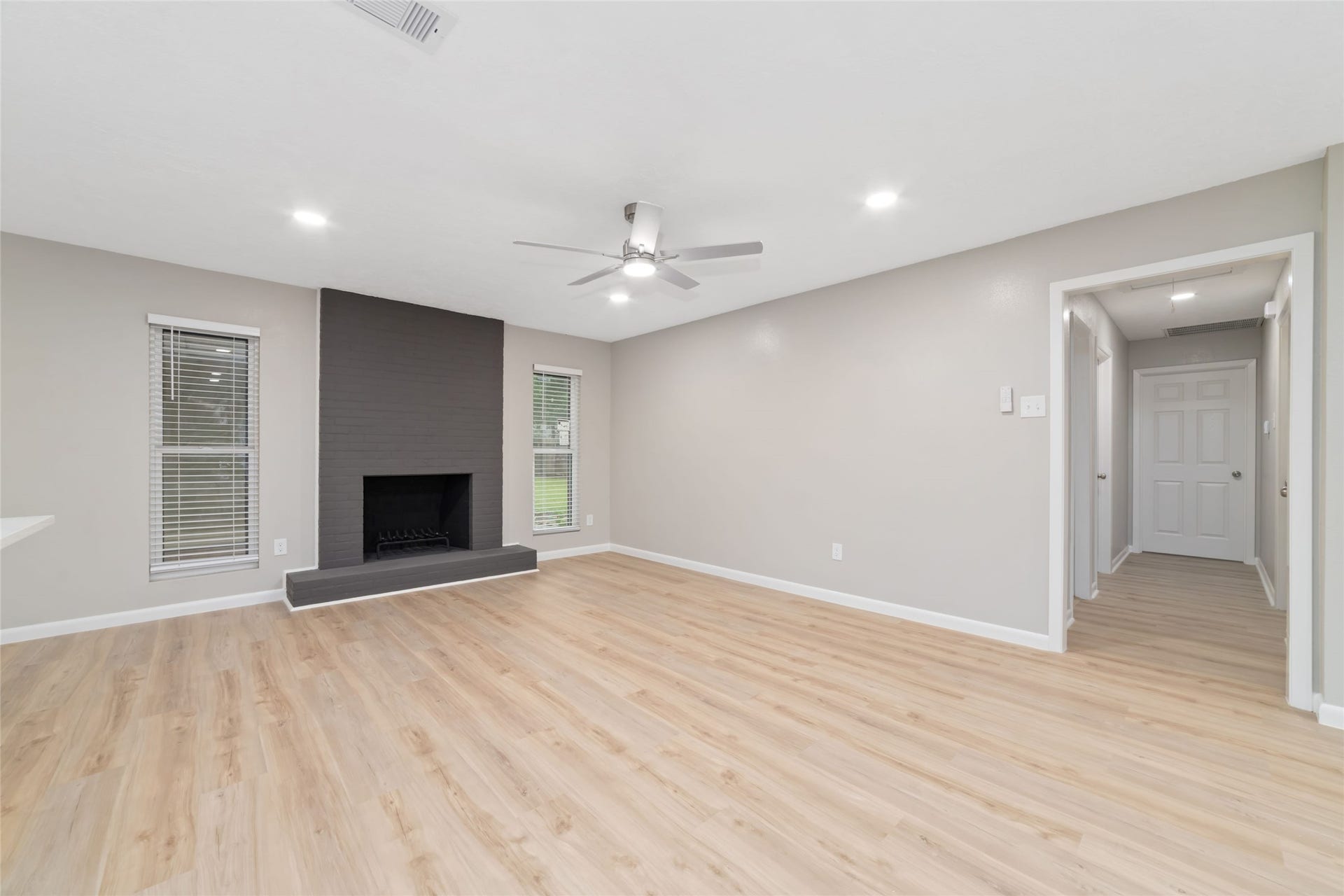2830 Westerland Drive, Houston, TX 77063 Let the brick fireplace anchor the room, then add a deep sofa, favorite books and something collected over time.