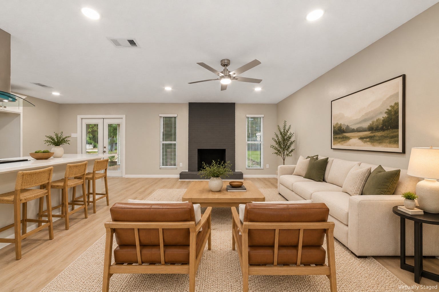 2830 Westerland Drive, Houston, TX 77063 A deep sofa, a pair of good chairs and the fireplace nearby. Friday night can stay right here. Virtually staged.