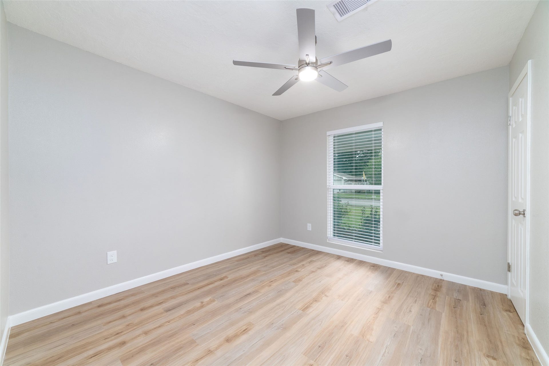 2830 Westerland Drive, Houston, TX 77063 Guest bedroom one is ready for visiting friends, with room for a proper bed and a place to unpack with dual closets.