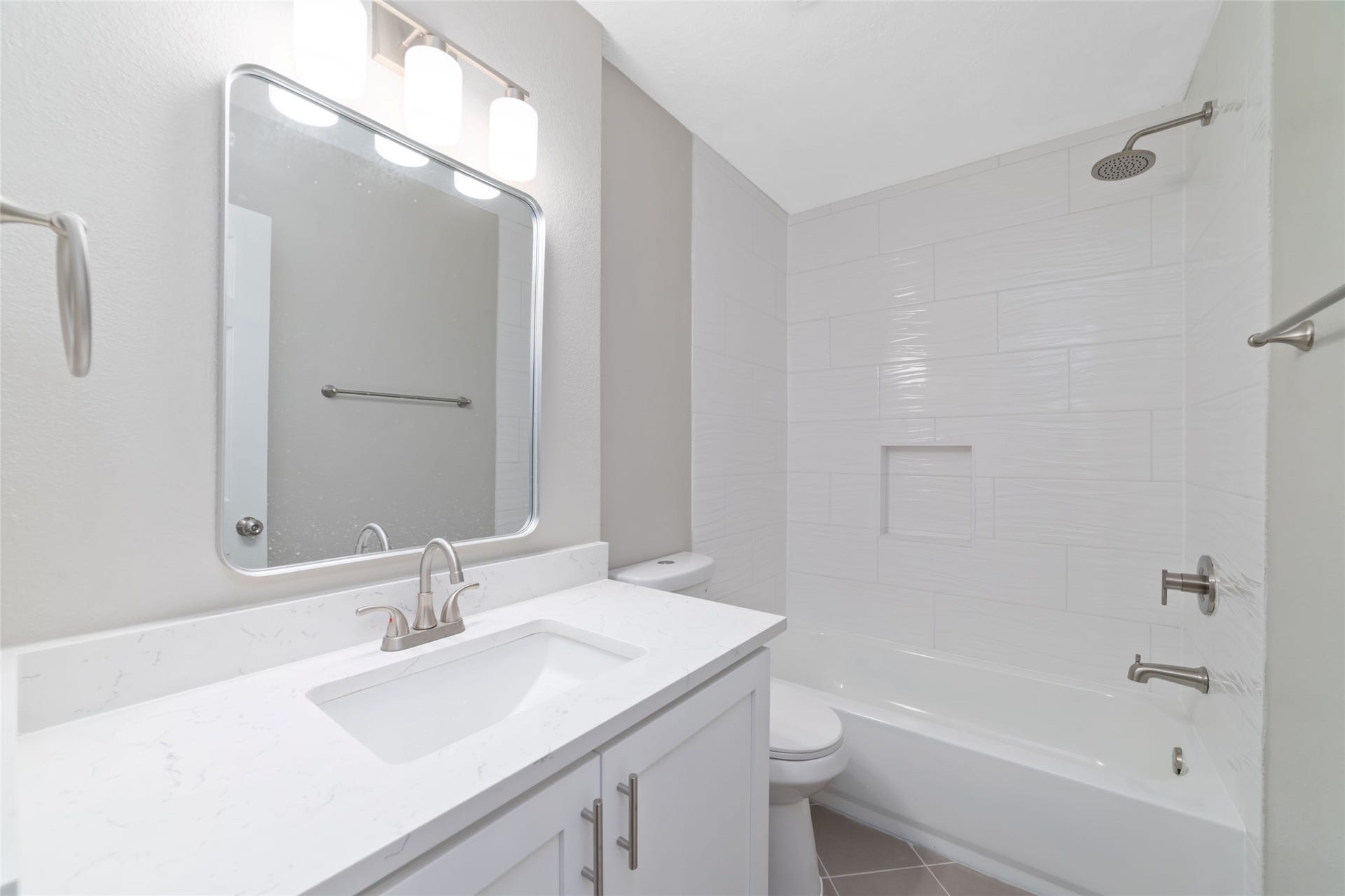 2830 Westerland Drive, Houston, TX 77063 Spacious newly renovated hall bath leaves room for bubble baths in the tub/shower combination and a large countertop space.