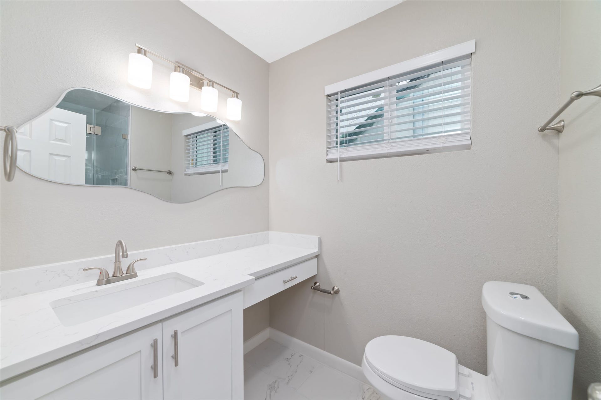 2830 Westerland Drive, Houston, TX 77063 The renovated primary bath gives you a generous vanity for getting ready without balancing everything around the sink.
